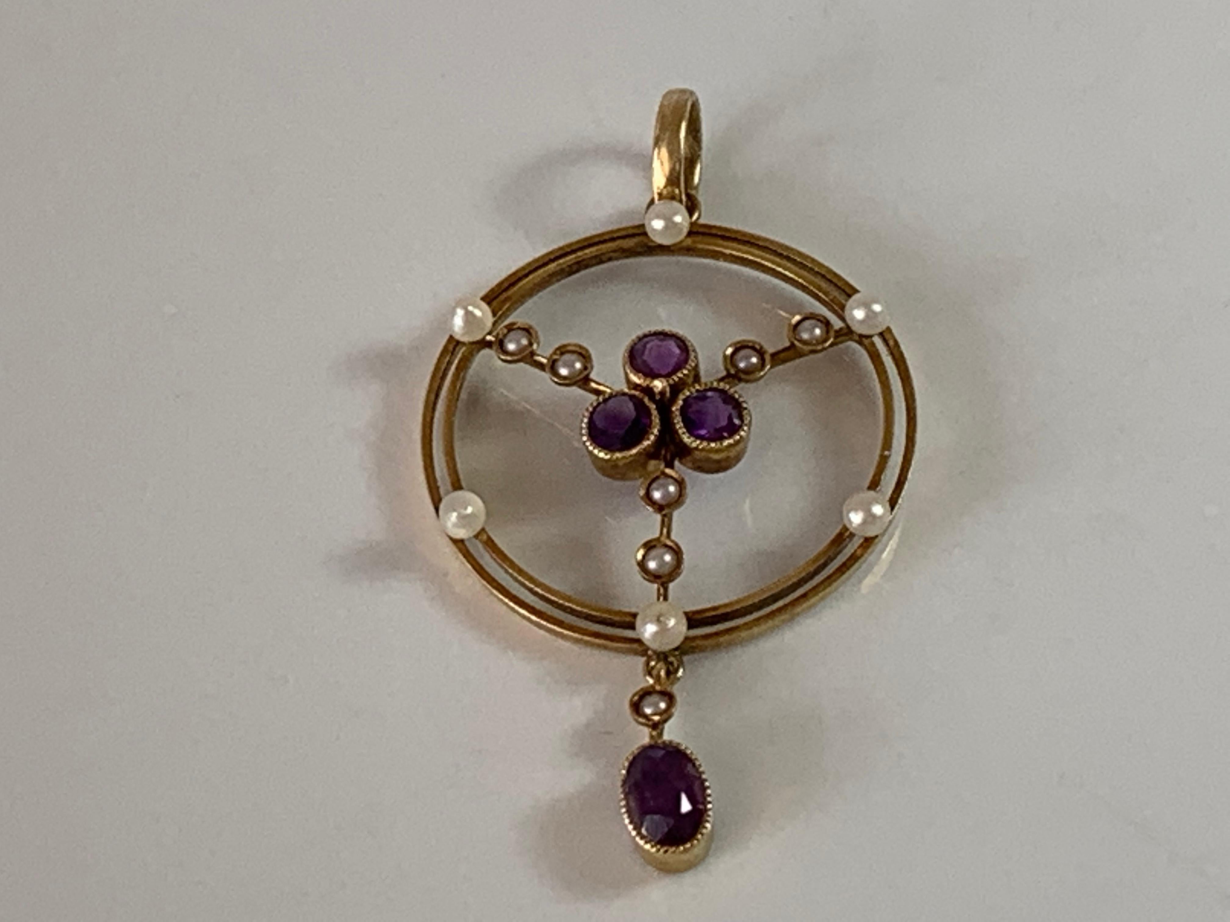 15ct 585 Gold Antique Pearl & Amethyst Pendant
Beautiful Symmetrical Edwardian Design 
and finished by a larger swinging Amethyst
Stamped 15ct on Bail

