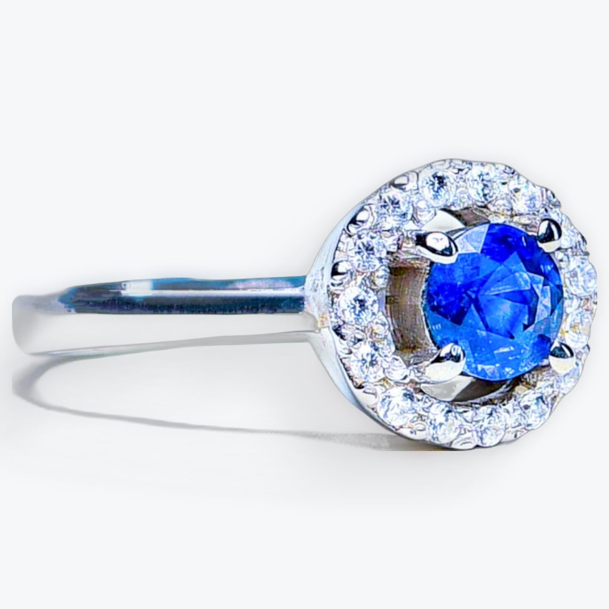 Celebrate your love story with the enduring beauty of this masterpiece.  This ring is designed to capture hearts with its exquisite blue sapphire centerpiece and the added brilliance of a halo of small white zircons.

At the center of this ring is a