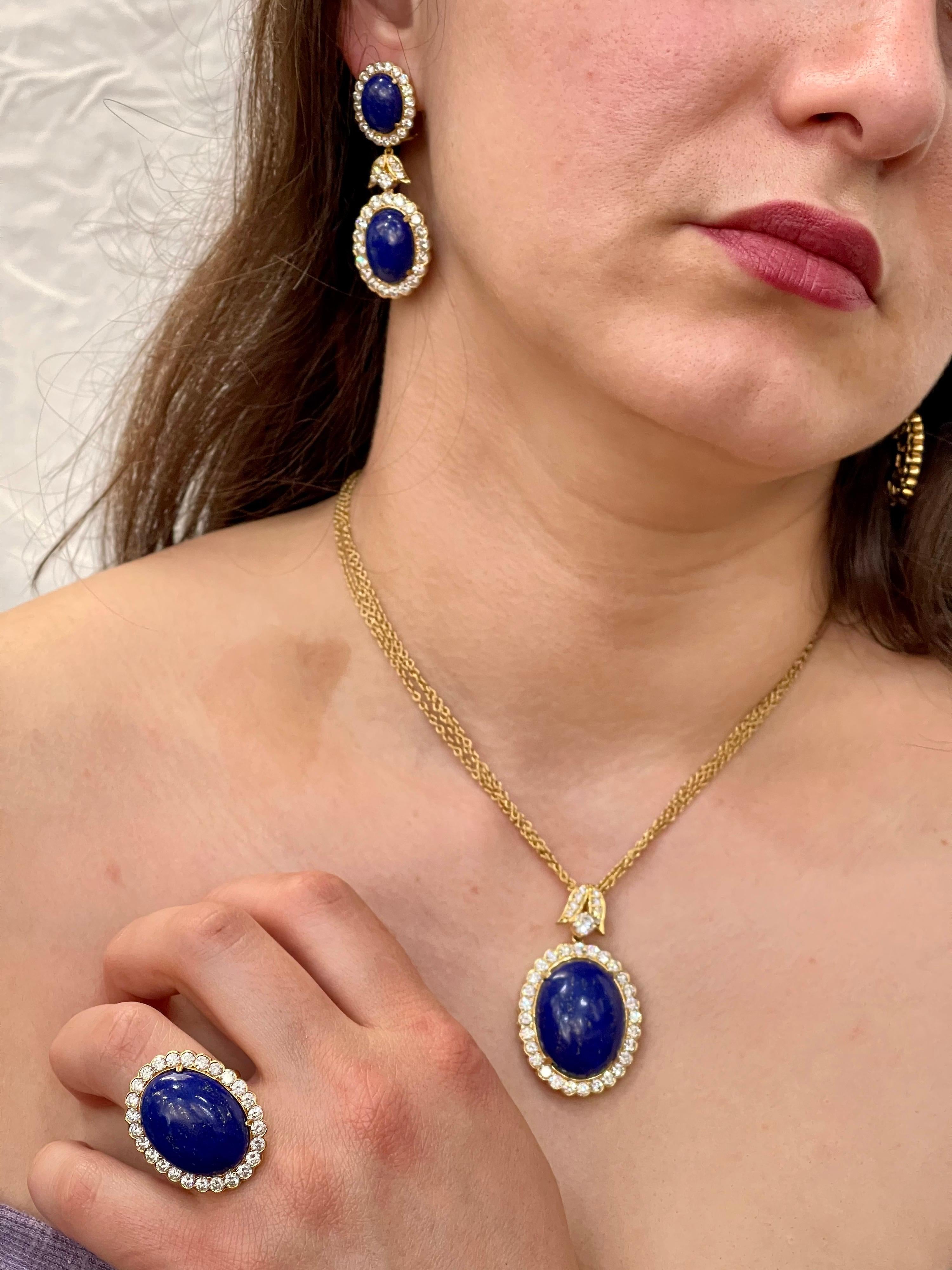 Approximately 15 Ct Diamond & 30+ Ct Natural Lapis Lazuli Set in 18 Karat  Yellow  Gold. Set Includes a Ring, a Earring, and a Pendant with three layer chain .
Made in Italy.
Ring size 5.5
This spectacular set consisting of  Natural Lapis Lazuli 