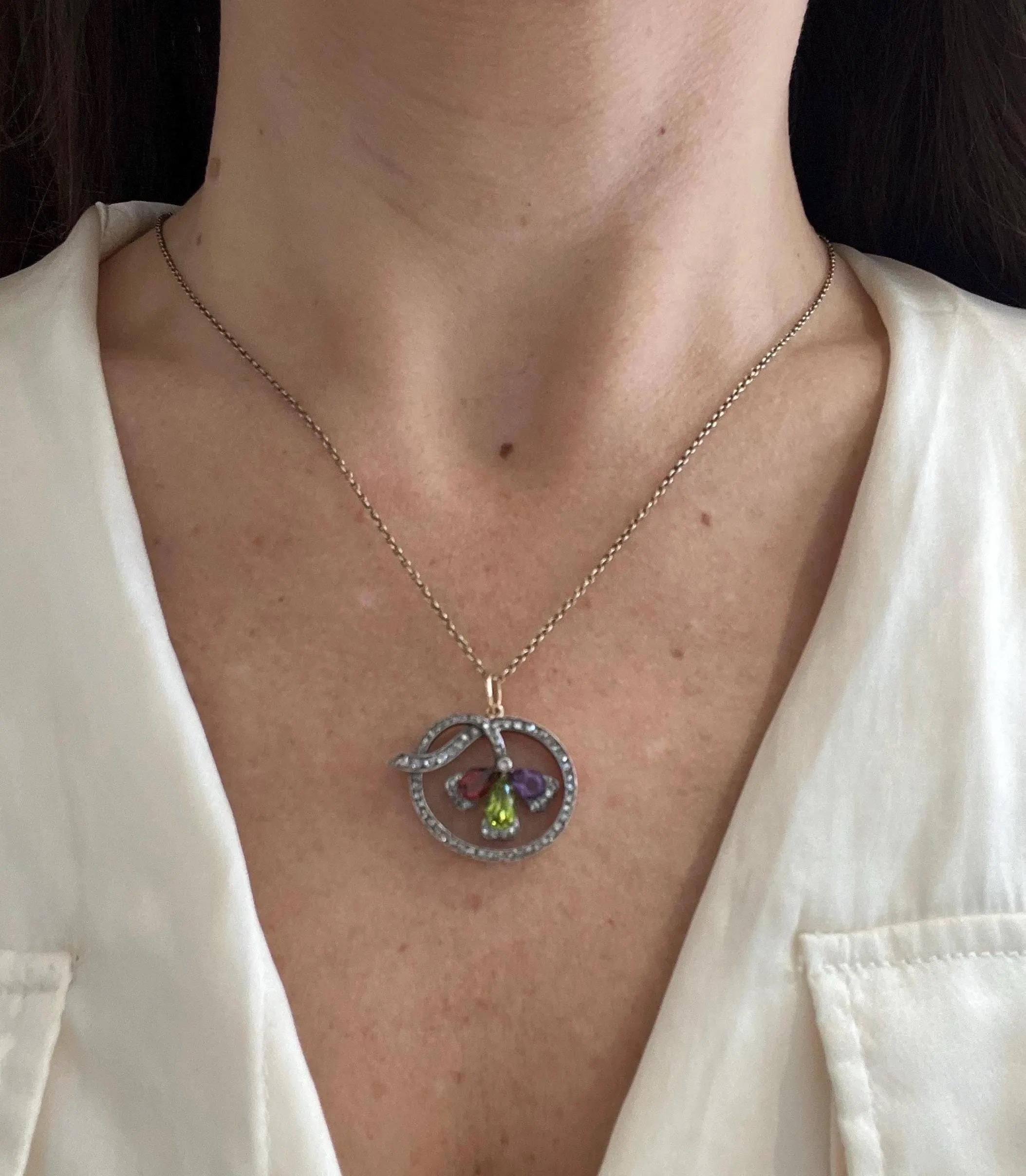 Antique Peridot, Garnet, Amethyst and Rose Diamond Pendant 

Circa 1910

15ct gold and Silver

* The chain is sold separately

Three stones. One story.
Amethyst for wisdom, peridot for renewal, garnet for passion—this antique pendant weaves emotion