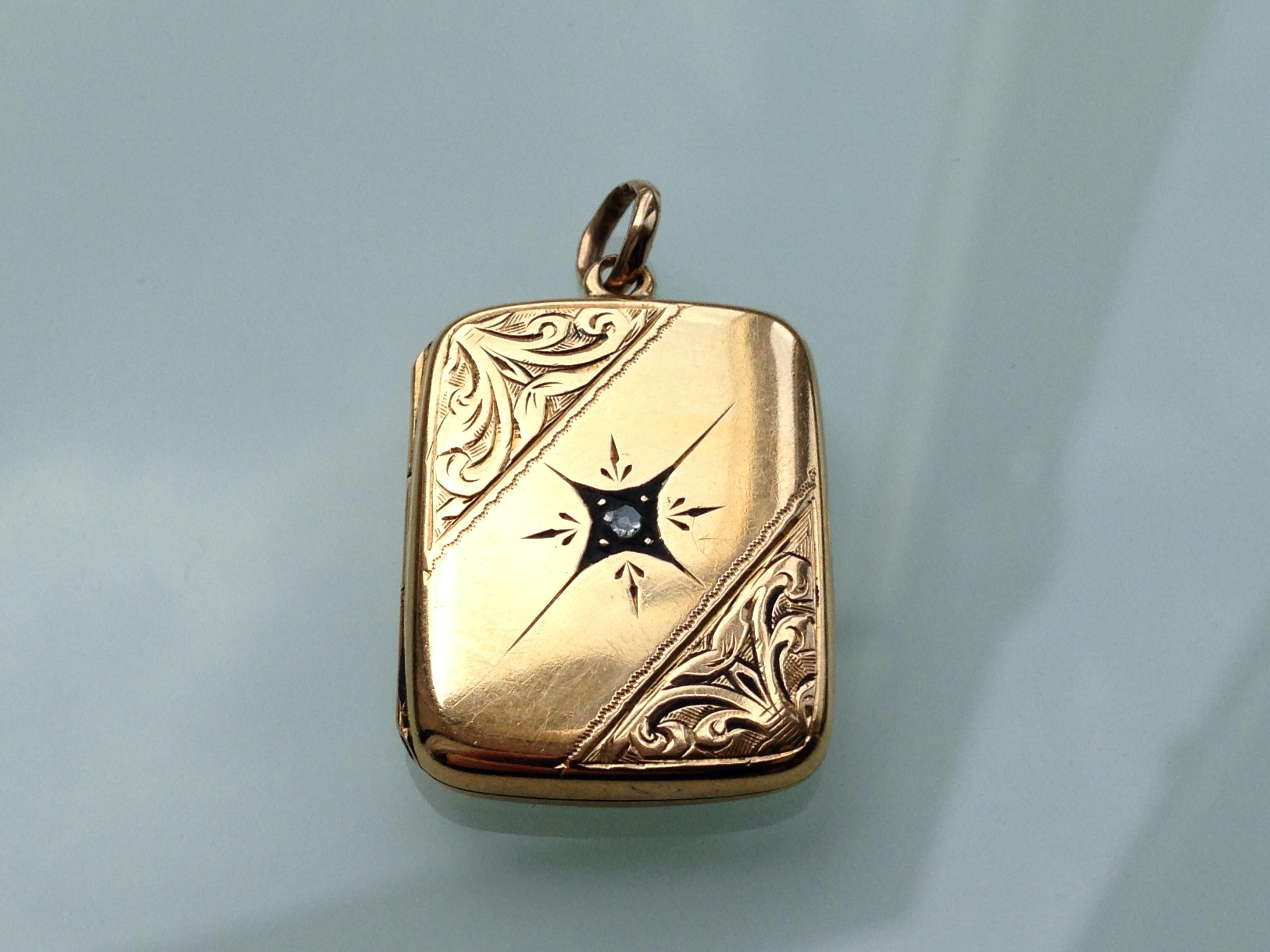 15ct 625 Gold Art Deco Locket
with scrolled design to front .
with its beautiful original mine cut natural diamond 
Backed rose gold back
Hallmarked by Chester Assay 1907
