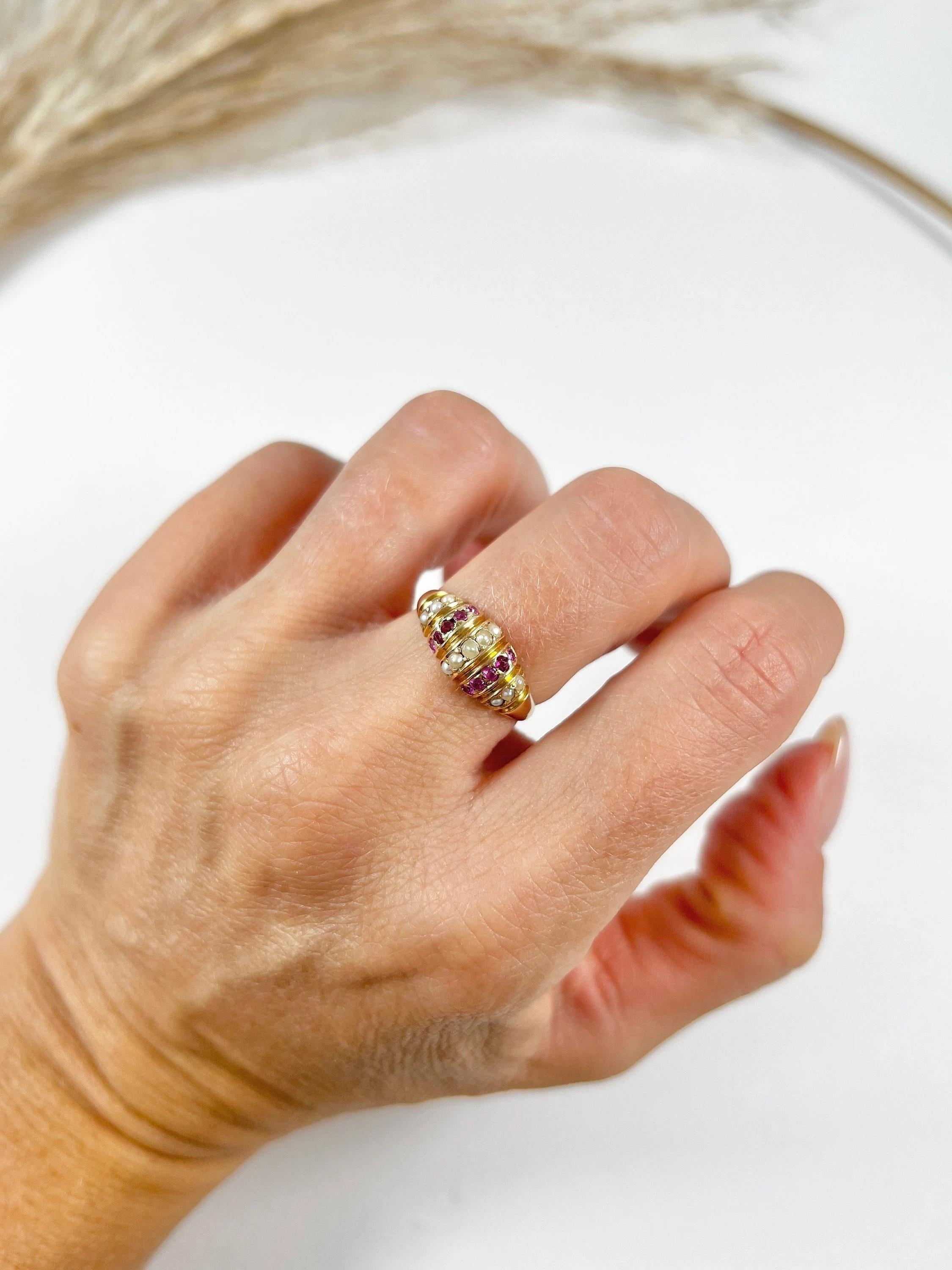 Antique Dome Ring

15ct Yellow Gold Stamped 

Hallmarked Birmingham 1876

This exquisite Victorian dome-shaped ring is crafted from 15ct gold and features vertical rows of alternating natural rubies and seed pearls. The craftsmanship of this piece
