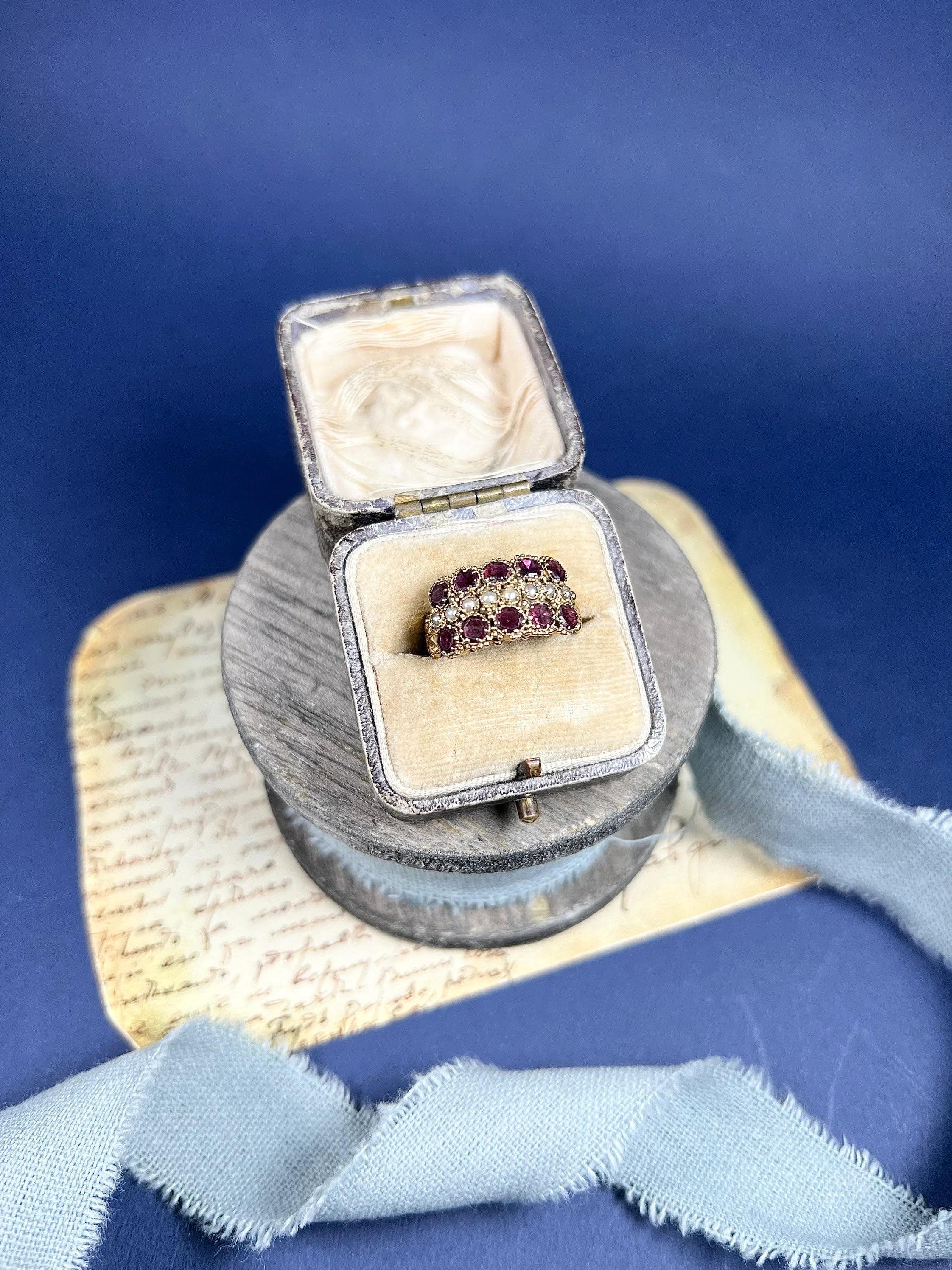 Round Cut 15ct Gold Victorian Garnet & Seed Pearl Triple Row Ring With Scrolled Shoulders For Sale