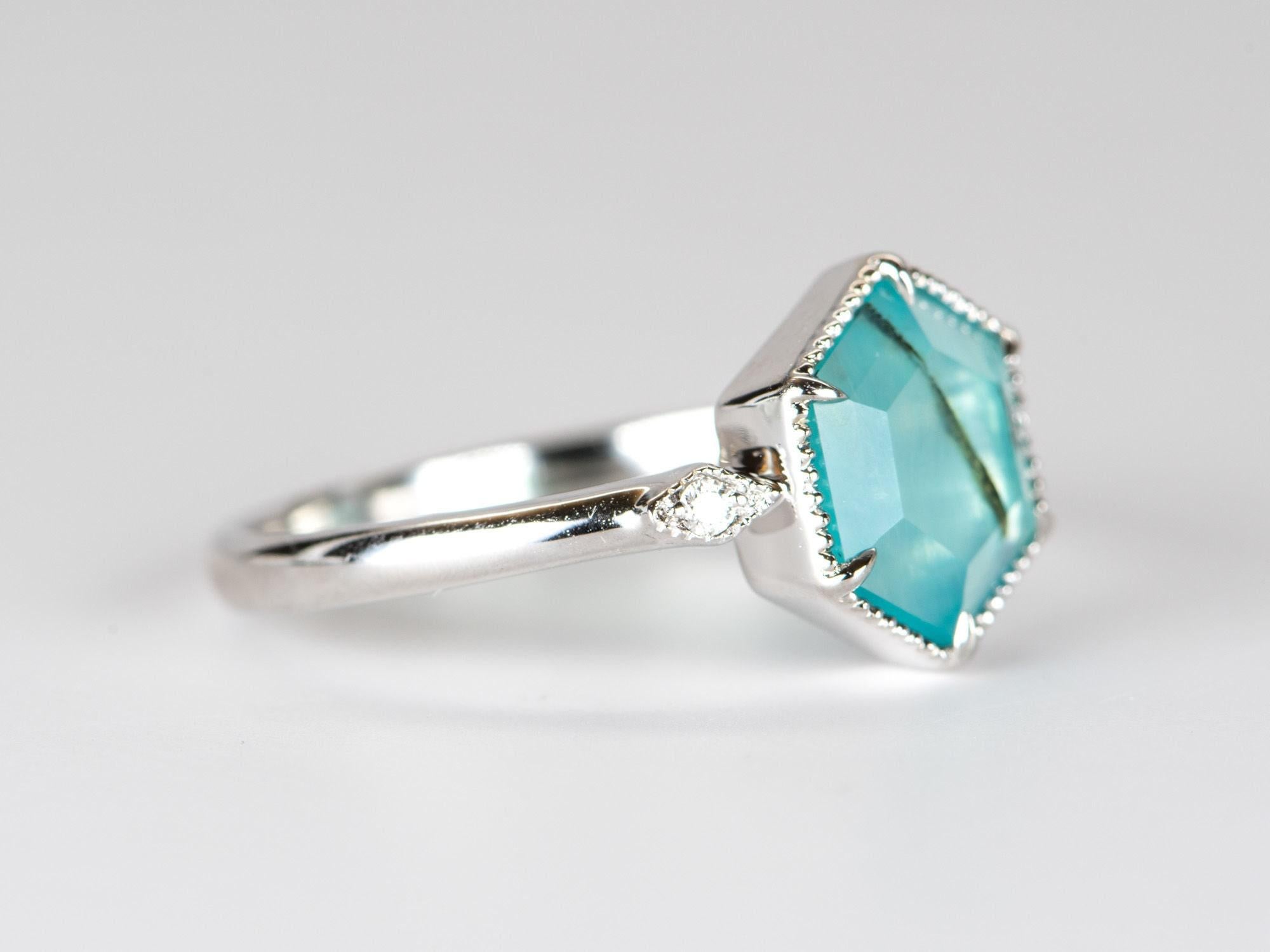♥ 1.5ct Hexagon Peruvian Blue Opal with Diamond Sides 14K White Gold Engagement Ring
♥ Solid 14k white gold ring set with a beautiful hexagon-shaped opal
♥ Gorgeous blue green color!
♥ The item measures 10.6 mm in length, 9.3 mm in width, and stands