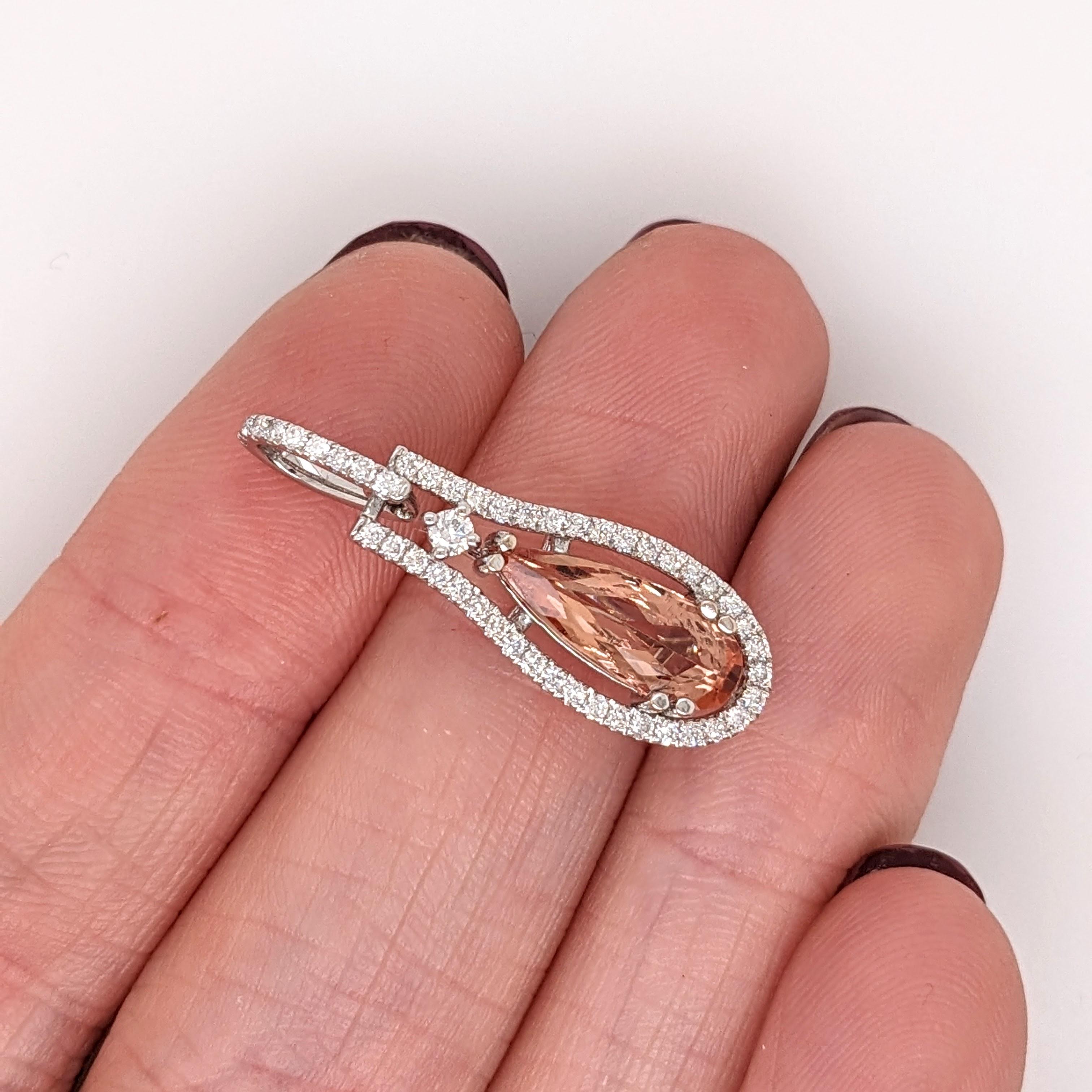This beautiful pendant features a pear shape 1.57 carat imperial topaz with natural earth mined diamonds all set in solid 14K gold. This pendant makes a lovely november birthstone gift for your loved ones! 

Specifications

Item Type: Pendant
Center