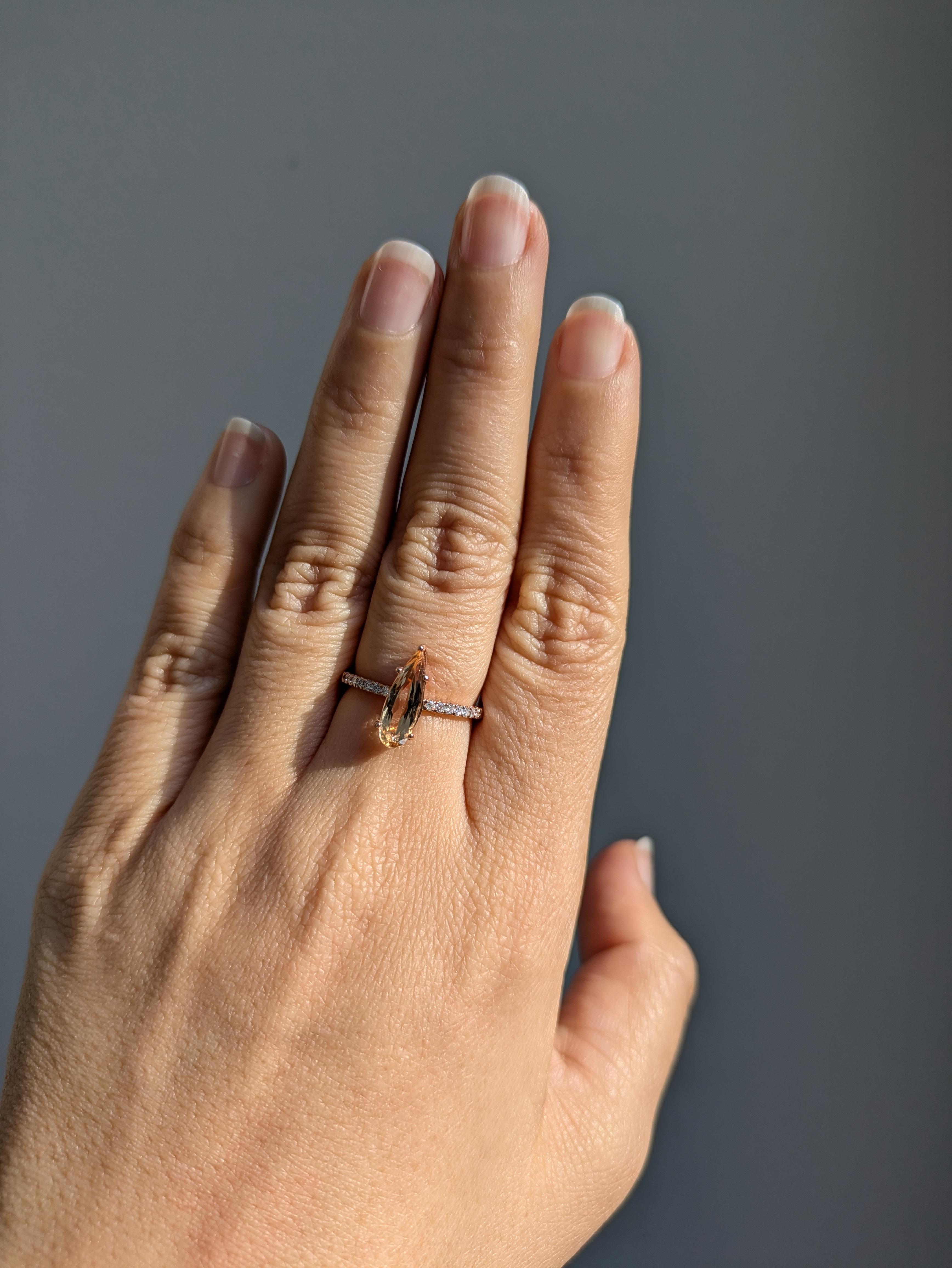 This beautiful statement ring features a 1.53 carat pear cut pink Imperial Topaz gemstone with natural earth mined diamonds set in solid 14K gold. This ring makes a lovely November birthstone gift for your loved ones!

**We offer complimentary