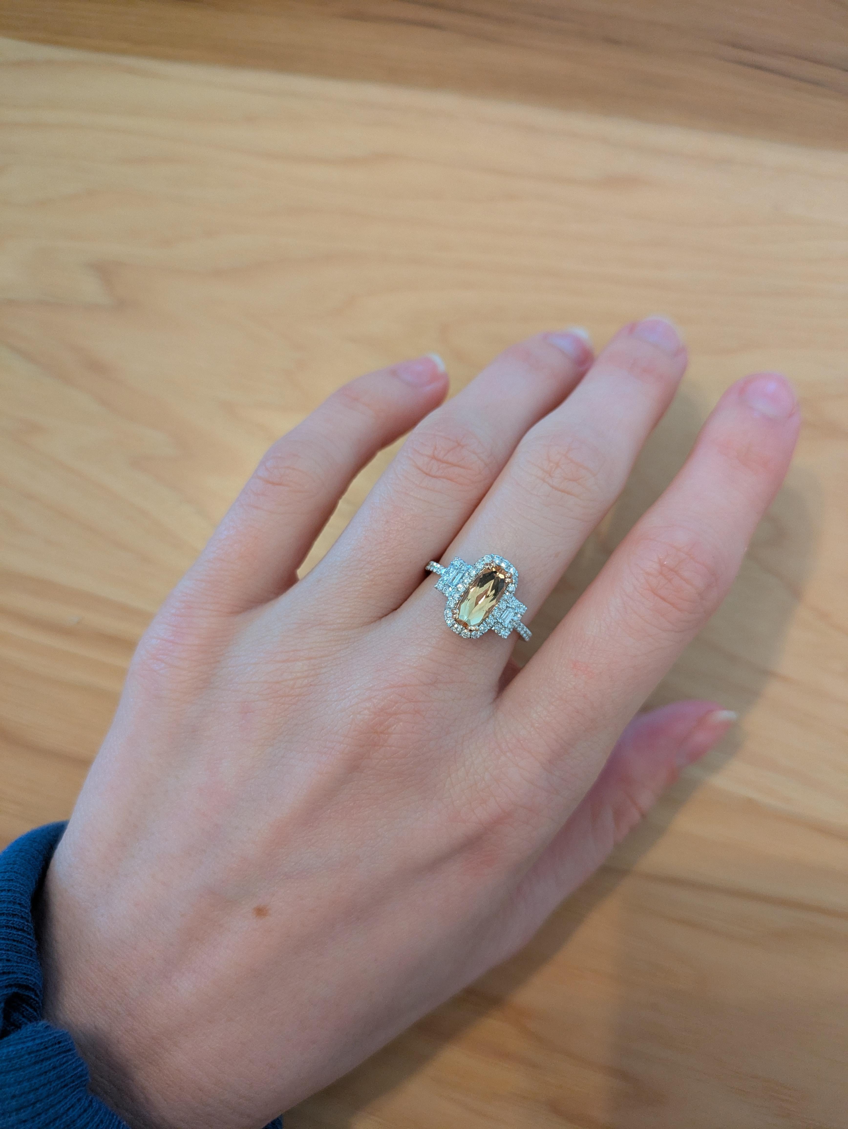 Make a statement with this 1.47 carat oval Imperial Topaz ring, glowing with golden-pink brilliance. Set in solid 14K real gold and accented with sparkling, earth-mined diamonds, it’s a radiant blend of elegance and bold beauty.

**We offer