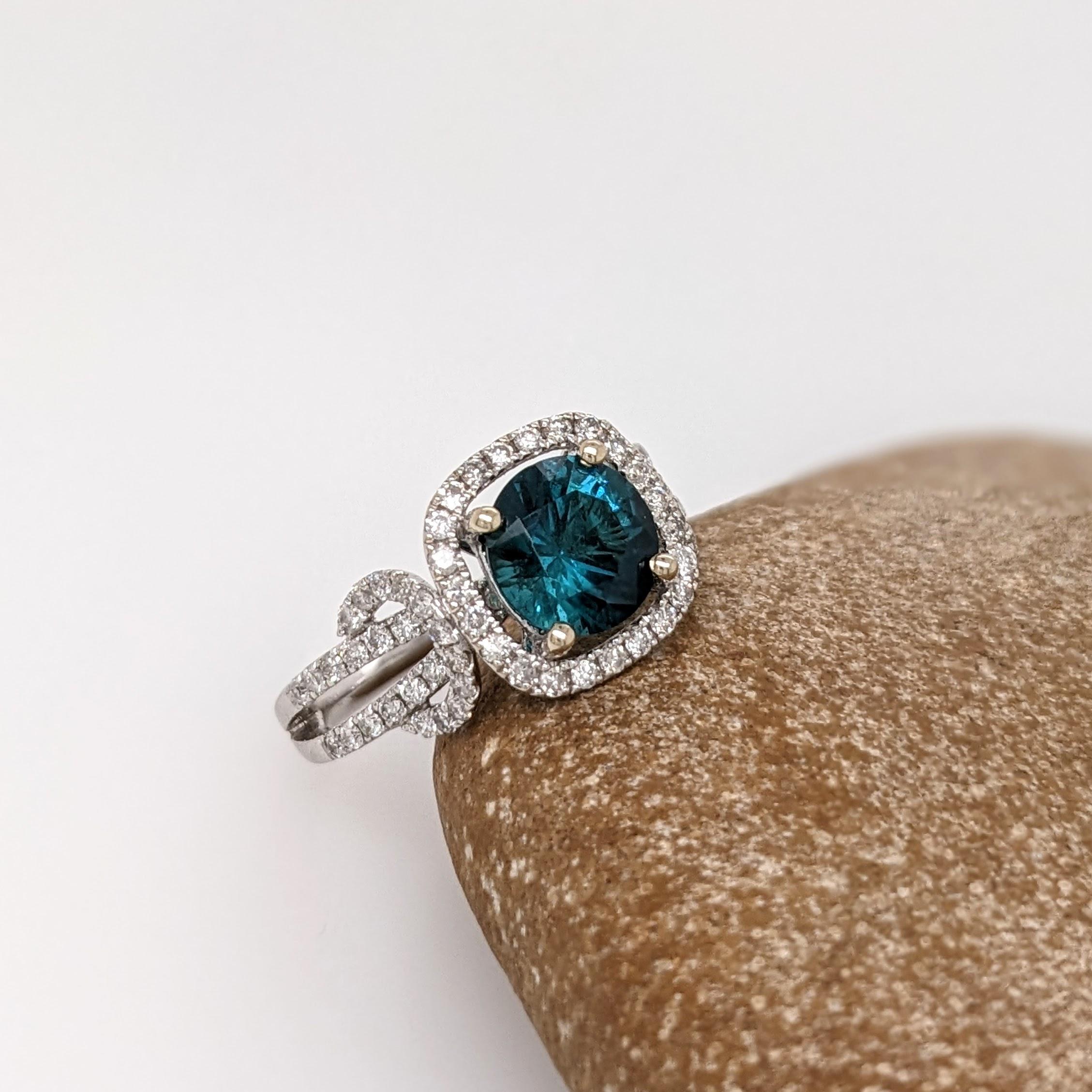 Presenting NNJ Designs' Summer Collection!

This beautiful estate ring features a 1.49 carat round indicolite tourmaline gemstone with natural earth mined diamonds and a pave split shank, all set in solid 14K gold.

Specifications

Item Type: