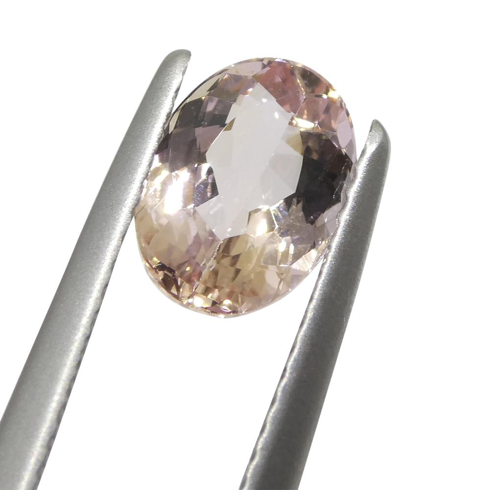 1.5ct Oval Orange-Pink Imperial Topaz GIA Certified In New Condition For Sale In Toronto, Ontario