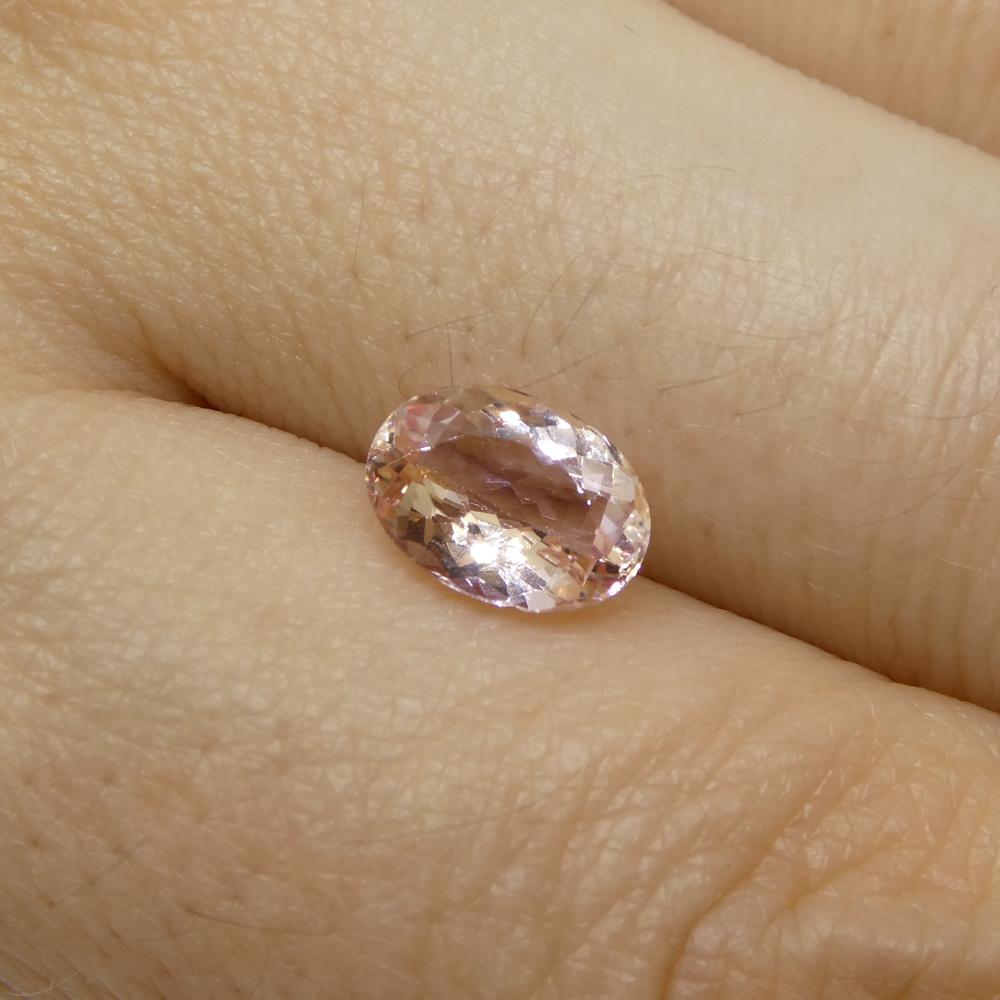 1.5 Carat Oval Orange-Pink Topaz GIA Certified For Sale 3