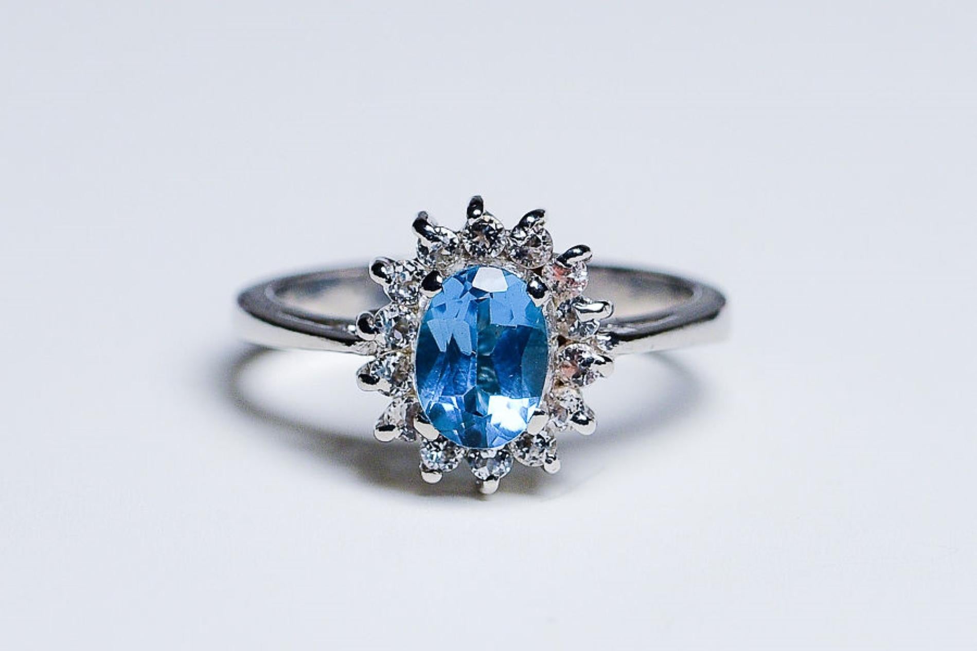 Presenting our 1.5ct Oval Topaz Platinum Silver Ring, a stunning piece that exudes elegance and sophistication. This ring features a mesmerizing 1.5ct Oval Topaz at its center, known for its captivating blue hue and exceptional clarity.

The Topaz