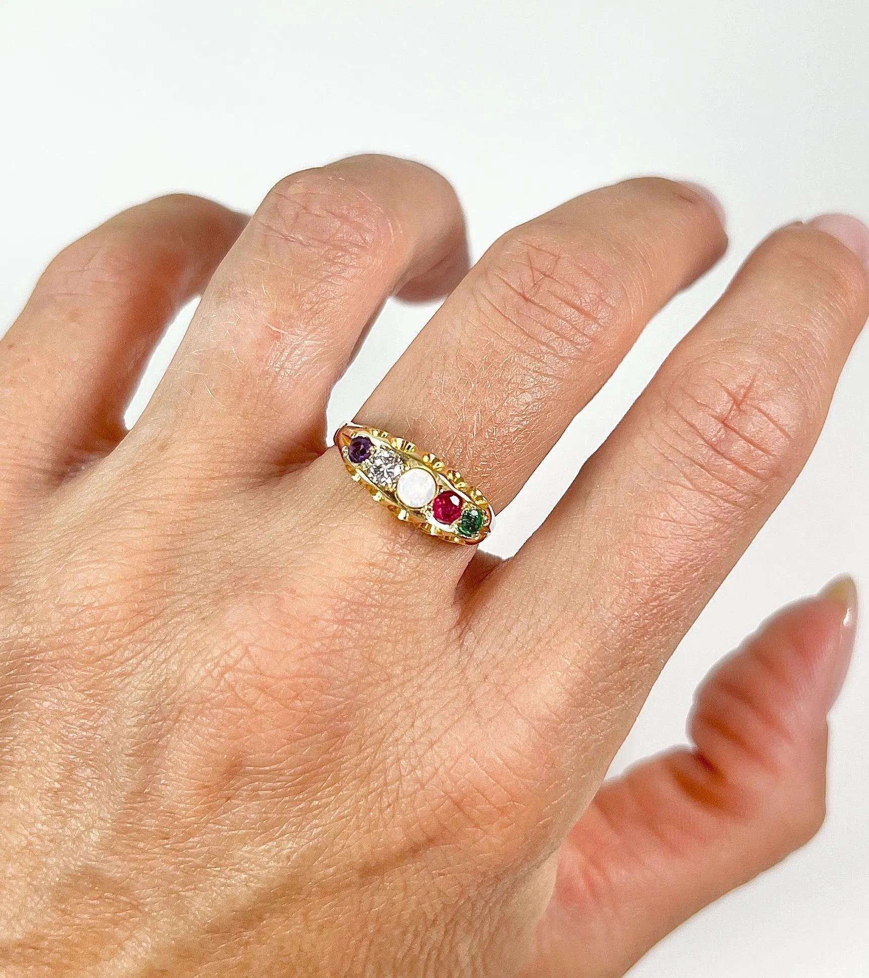 Antique Adore Ring 

15ct Gold Stamped 

Circa 1880

Introducing a breathtaking 15ct gold Victorian acrostic ring, adorned with a captivating combination of amethyst, diamond, opal, ruby, and emerald stones delicately spelling out the word 