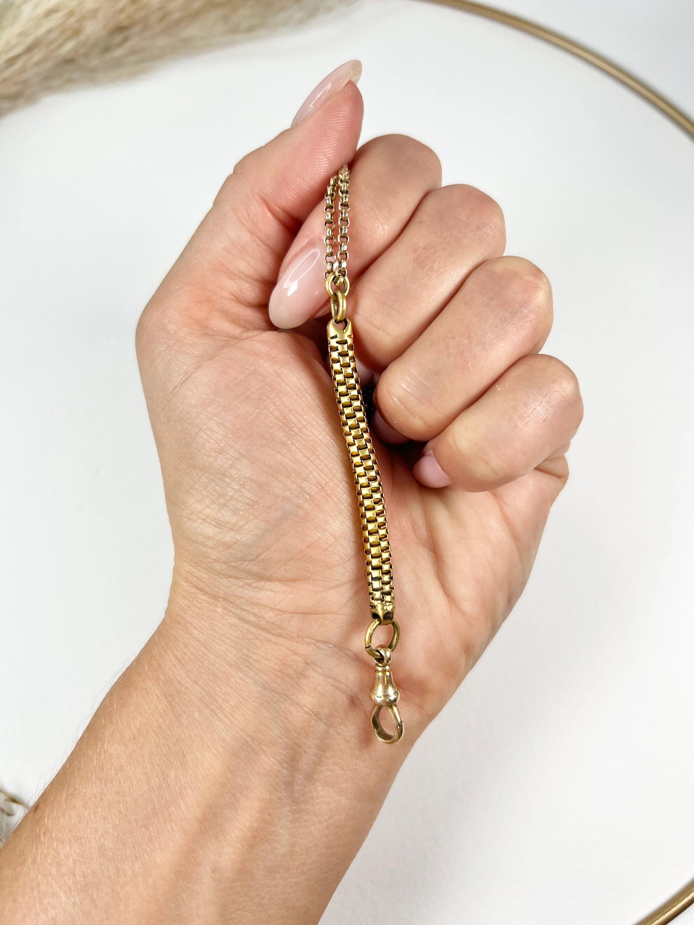 Antique Gold Chain Extender

15ct Yellow Gold Tested 

Circa 1900

Add a touch of versatile elegance to your jewellery collection with this exquisite 15ct yellow gold snake link extender chain. This beautiful chain is designed to be worn as either a