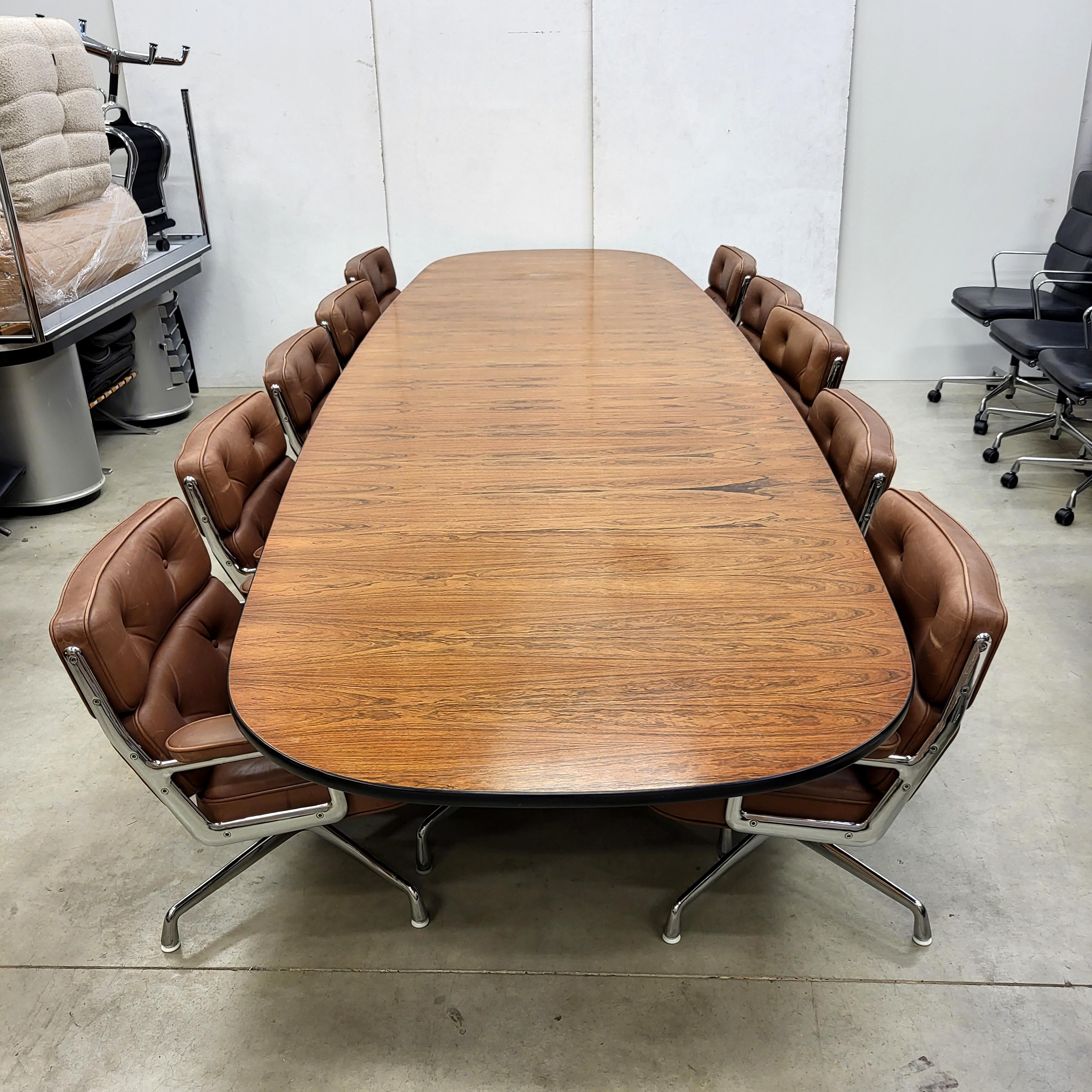 This lot is a 1 of a kind opportunity!

Fine and very rare 15ft segmented table by Charles Eames for Herman Miller with 10x superb Midbrown office lobby chairs model ES105 produced by Vitra. The chairs features a chromed aluminium frame and are all