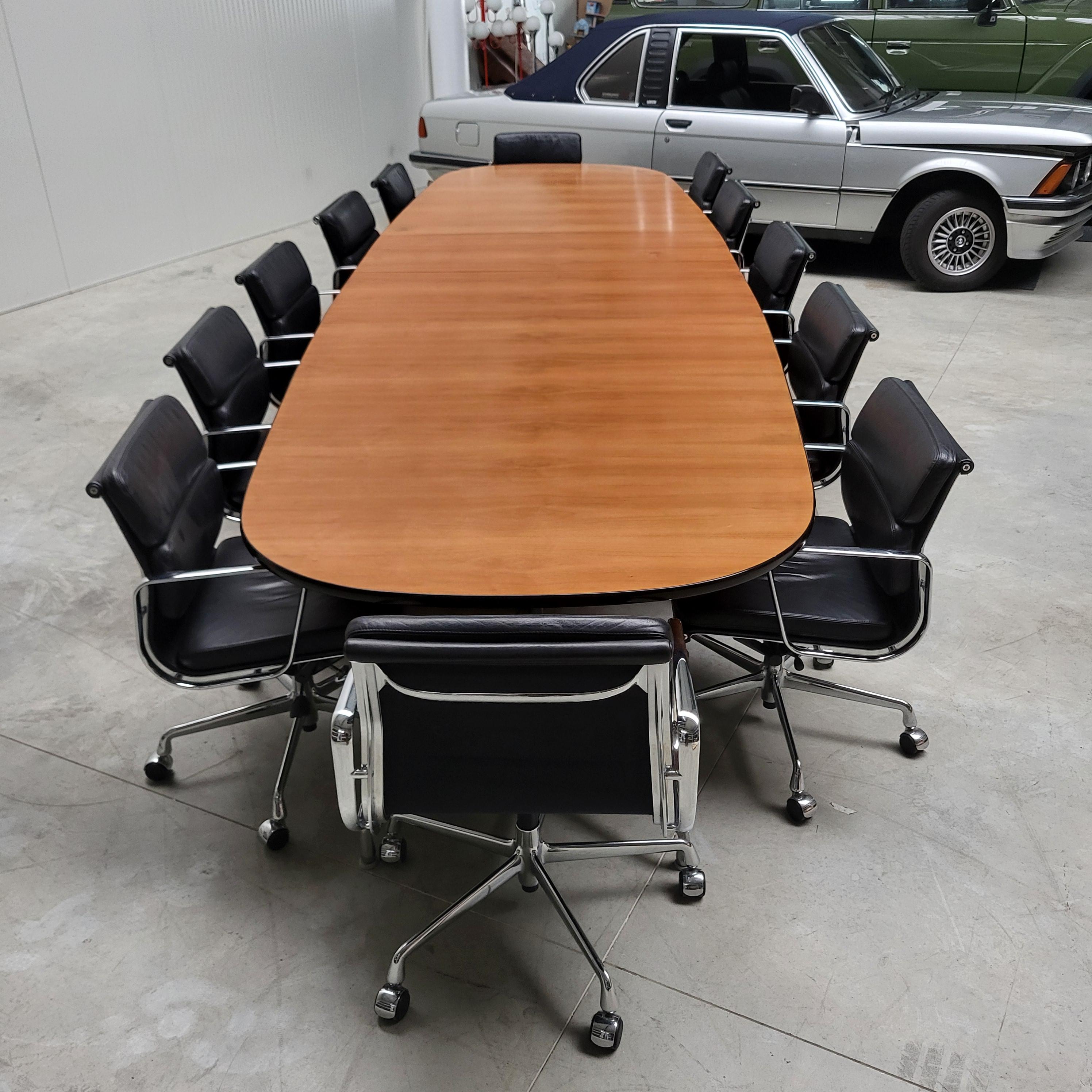 This amazing segmented table by Charles with 12x Soft Pad chairs is a 1 of a kind opportunity!

Fine and very rare 15ft Walnut segmented table by Charles Eames for Herman Miller, circa 1978, with 12x soft pad office chairs model EA217 by Vitra, all