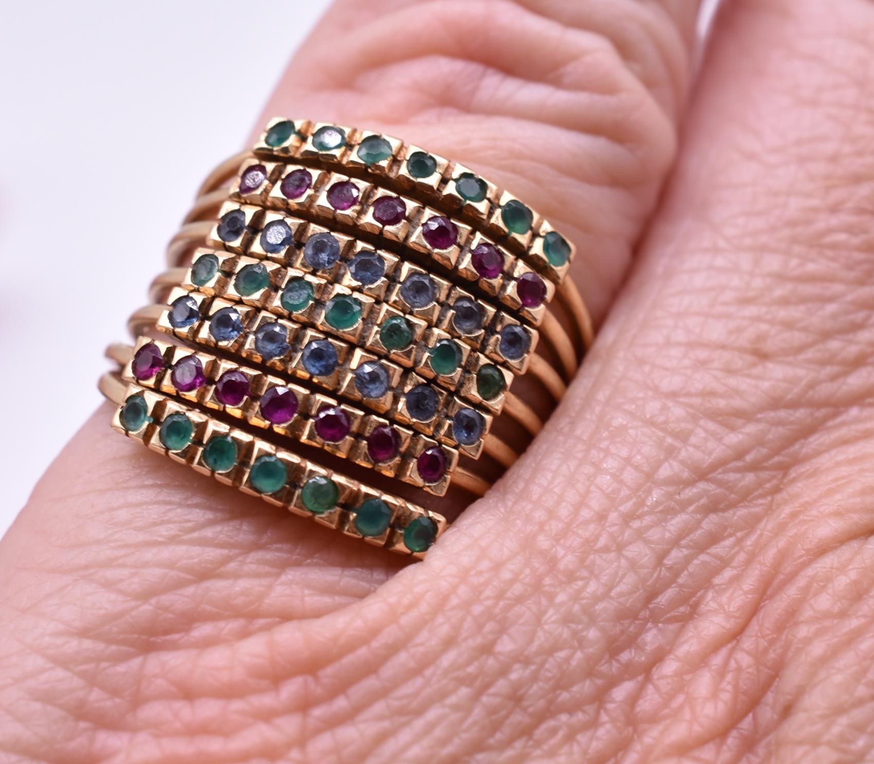 15K lucky seven harem ring, with seven bands of emeralds, rubies, and sapphires, and 7 gems on each band. Tradition has it that harem rings originated in Turkey, the rings  to be given to brides. The greater the number of bands, the more important