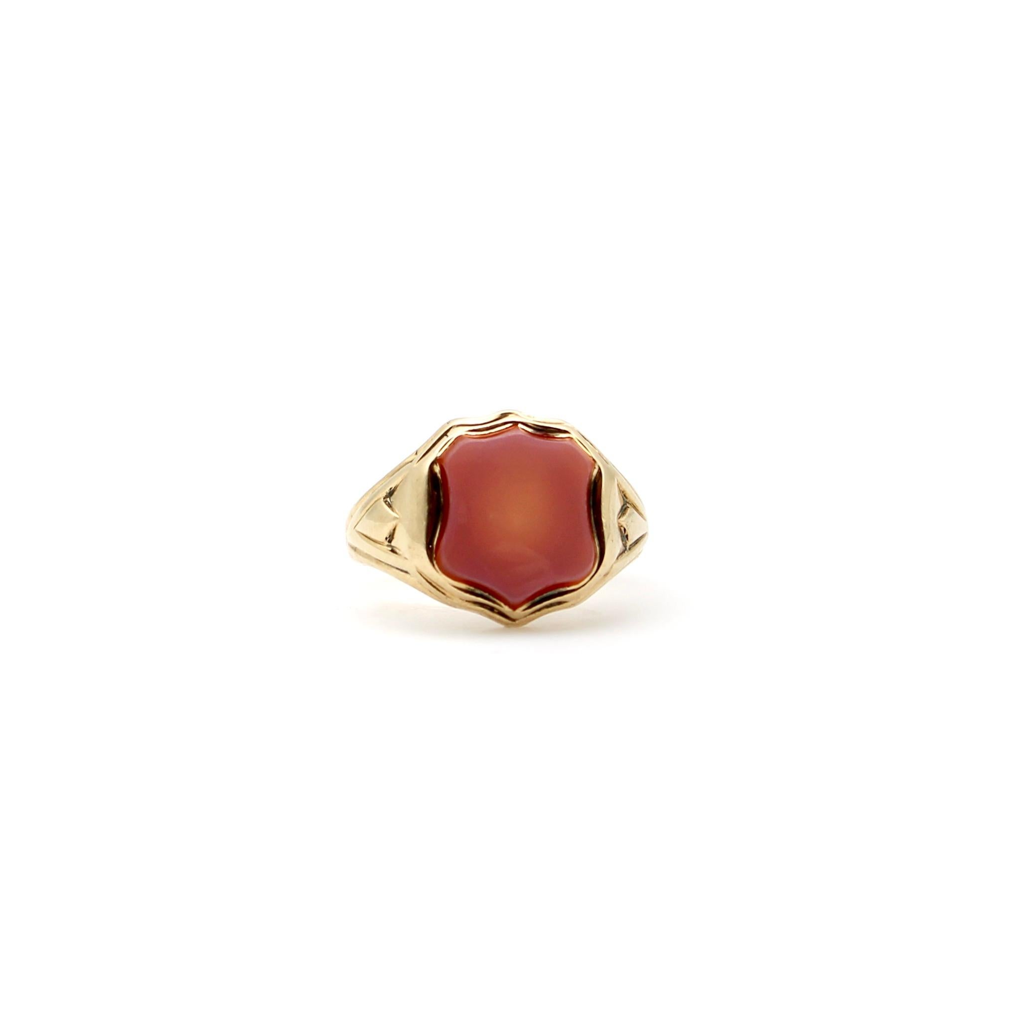 The banded agate in this 15k gold Victorian signet ring was left uncarved—allowing the agate’s beauty to be the centerpiece of the ring. The surface layer of the stone is a lavender purple-grey. Beneath it is a carnelian-colored amber red that is