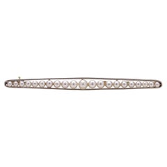  15kt. yellow gold and platinum elongated brooch with cultured pearls 