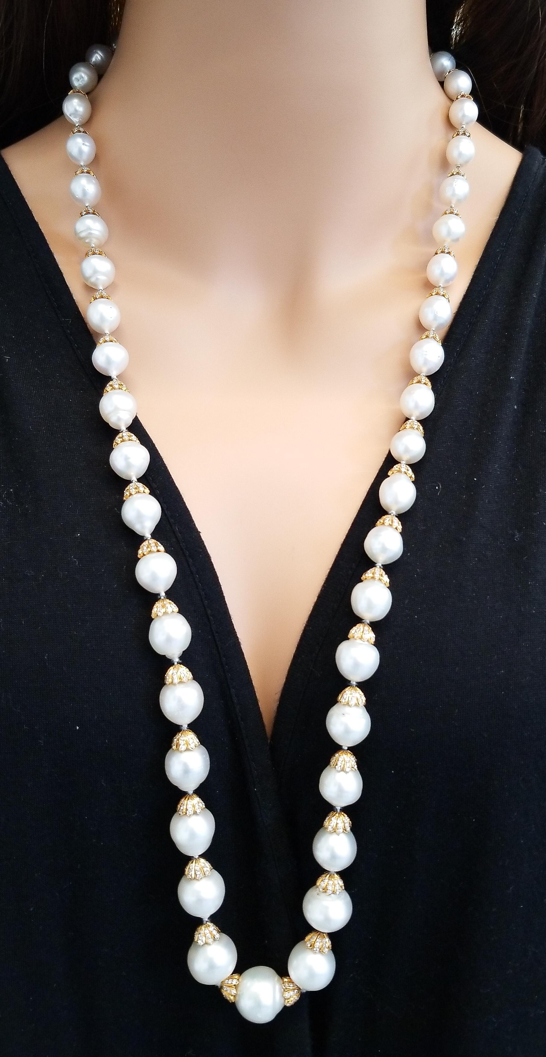 This is a truly special Australian South Sea pearl necklace measuring an impressive 34 inches in length and features white South Sea pearls that measure 15 mm to 8 mm in diameter, all hand-strung perfectly. Rich brightly polished 18 yellow gold cap