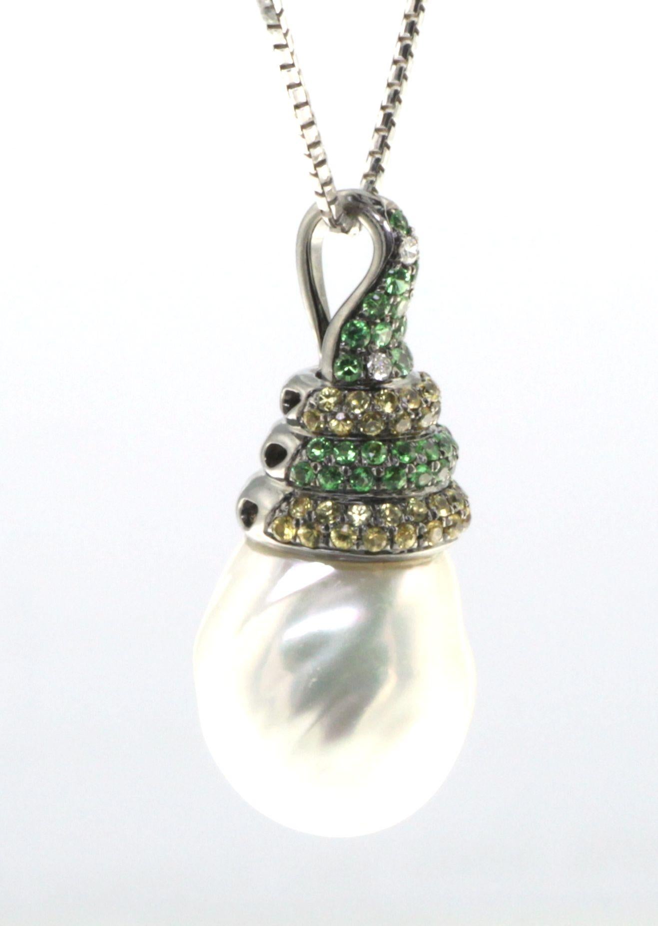This pendant is an exquisite piece that features a baroque South Sea pearl, full of character and natural beauty. The 15mm pearl, with its distinctive irregular shape and captivating luster, is a testament to the unique allure that only a baroque