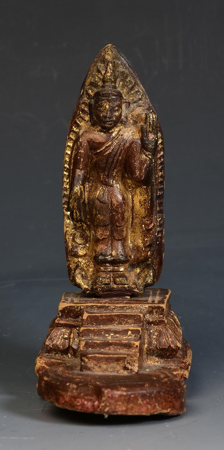Burmese pottery standing Buddha.

Age: Burma, Ava Period, 15th Century
Size: Height 13.4 C.M. / Width 6.2 C.M. / Length 10.7 C.M.
Condition: Nice condition overall (some expected degradation due to its age).

100% Satisfaction and authenticity