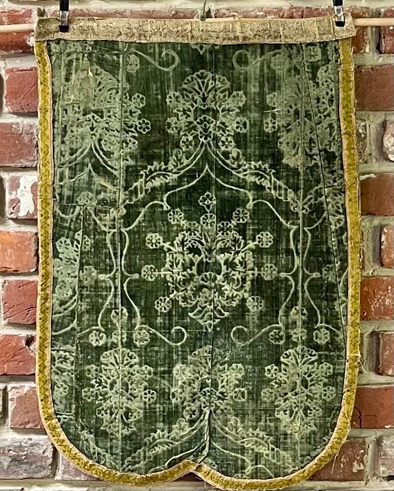 

Voided Olive Green silk velvet showing the Ferronerie pattern

Left and Right panels from a dismantled Chasuble

Joined and made up from several sections

Florence or Venice dating from second half of the 15th Century

The silk and metallic braids
