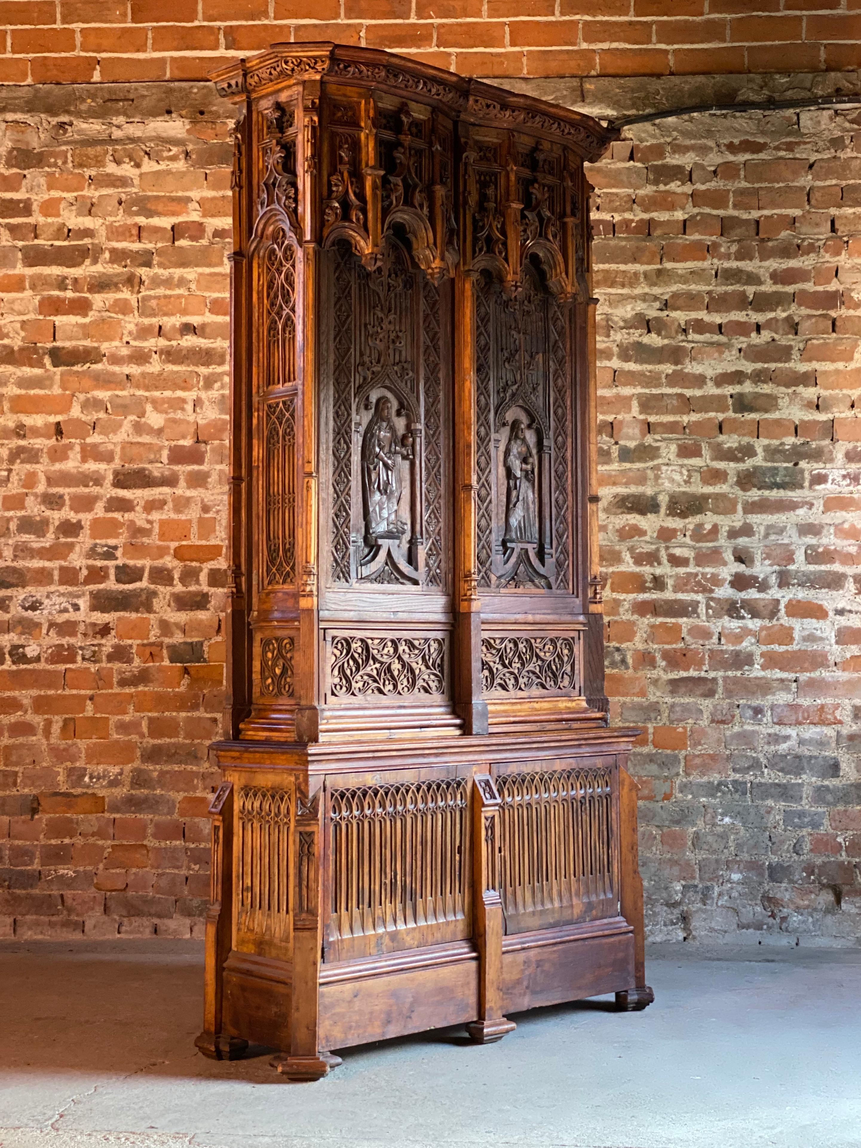 15th century French style Gothic Revival oak cupboard heavily carved, circa 1850

A magnificent, tall and imposing 15th century French style Napoleon III Gothic revival oak cupboard dating to circa1850, with extensive carved architectural decor