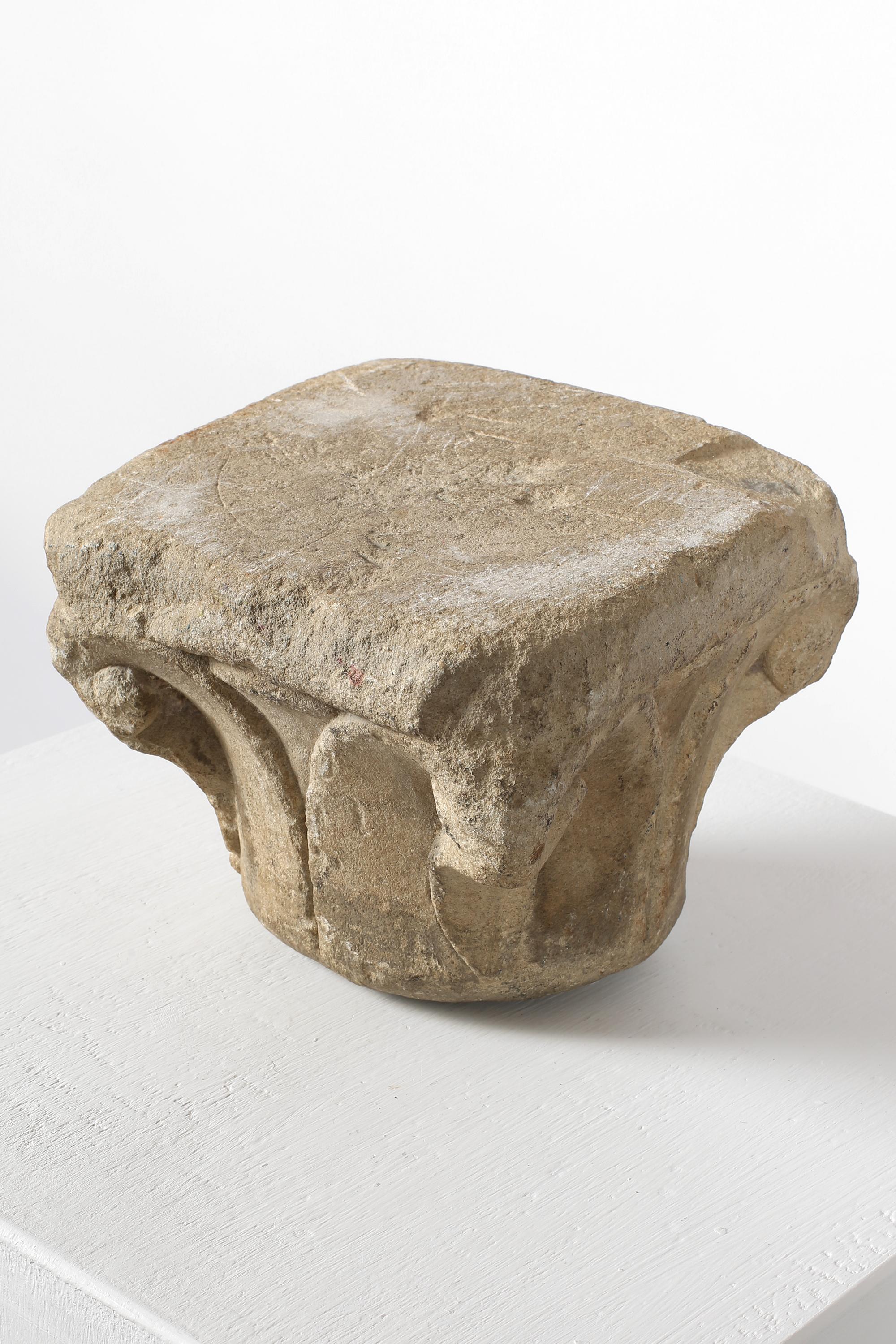 A 15th century carved stone architectural fragment from Tuscany. Likely the capital or base of a decorative column, or other architectural element. Italian, c. 1450.