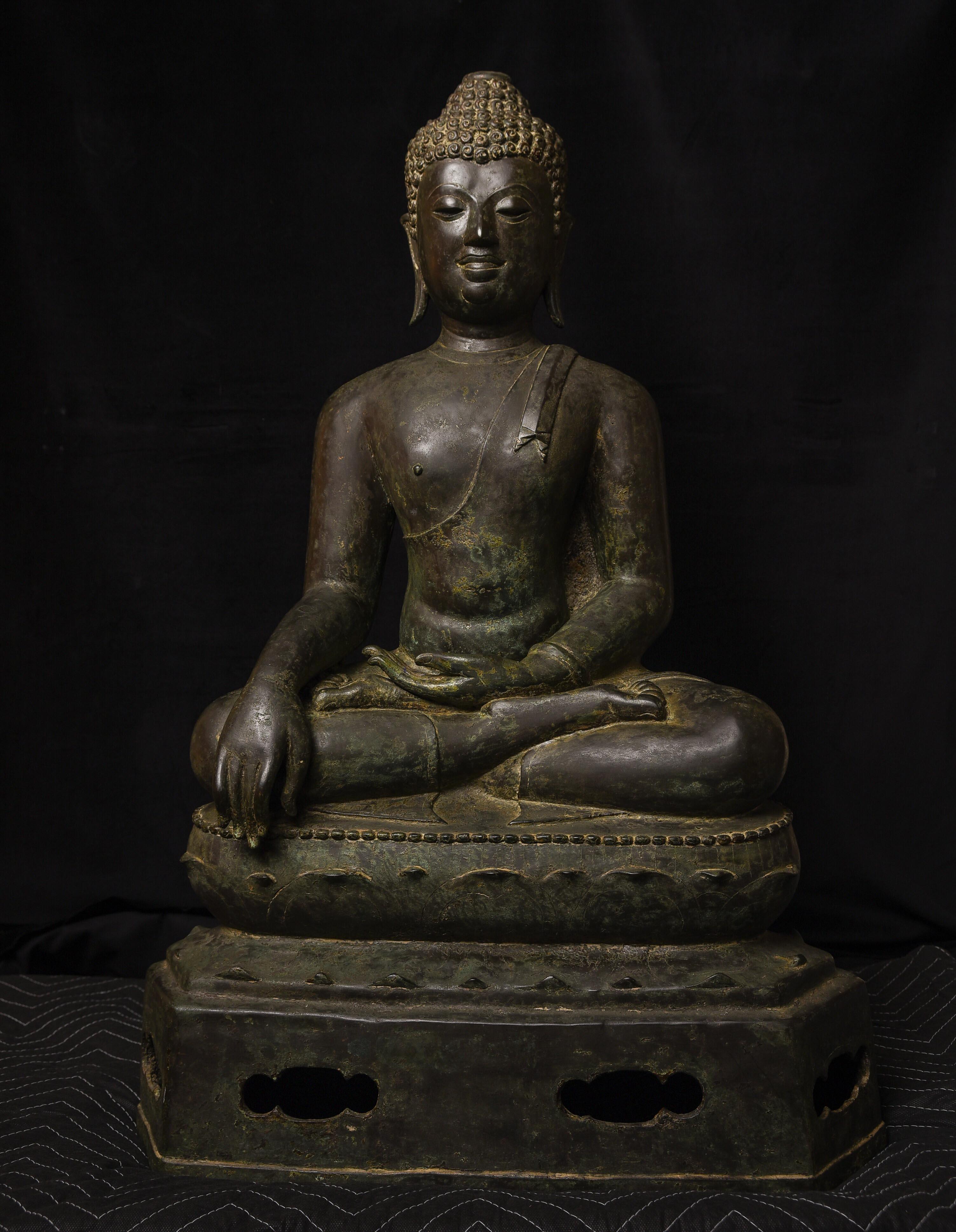 Masterpiece 15th century Northern Thai bronze Buddha. This is the best of the best. Traces of gilding in the crevices of the hair, behind the ears, etcetera. The casting is crisp, the sculpting shows great finesse and depth, the patina is beautiful