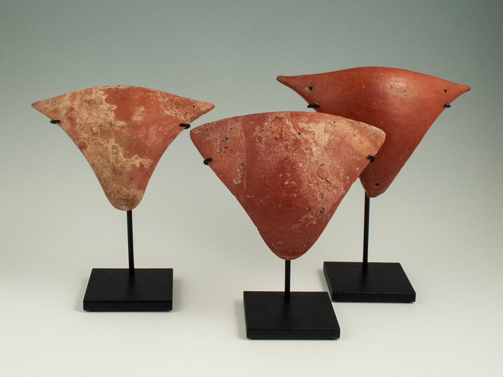15th Century or Earlier Redware Tangas, Marajoara culture, Marajo Island, Brazil

Tangas are thin concave triangular ceramic pubic covers found in burial mounds associated with females. The holes at the corners are believed to be string holes,