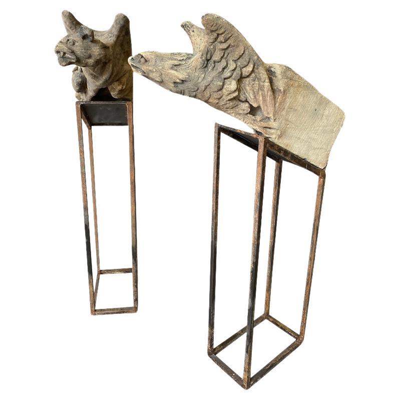 An exceptional pair of English 15th century Gargoyles - Gargouilles - Elements from a Monument, carved from stone.  Outstanding patina.  Now resting on their iron stands.  Tremendous art - sculpture pieces.  The dimensions of each gargoyle is 32 X
