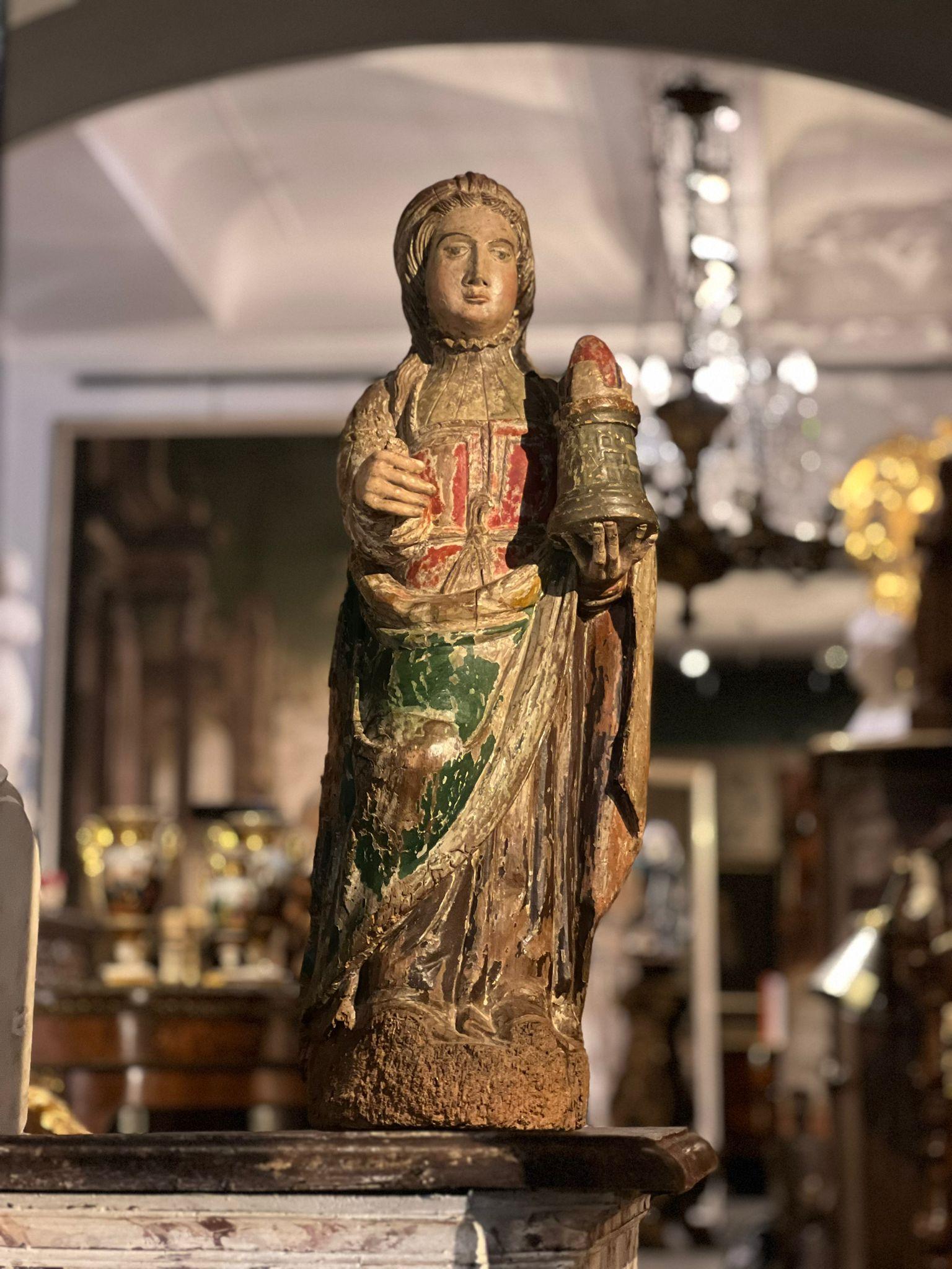 Rare polychrome wooden sculpture depicting Saint Barbara, 15th century, France.

Saint Barbara is a saint venerated in the Christian tradition, known for her history and legend. She is often depicted with a tower, as it is associated with protection