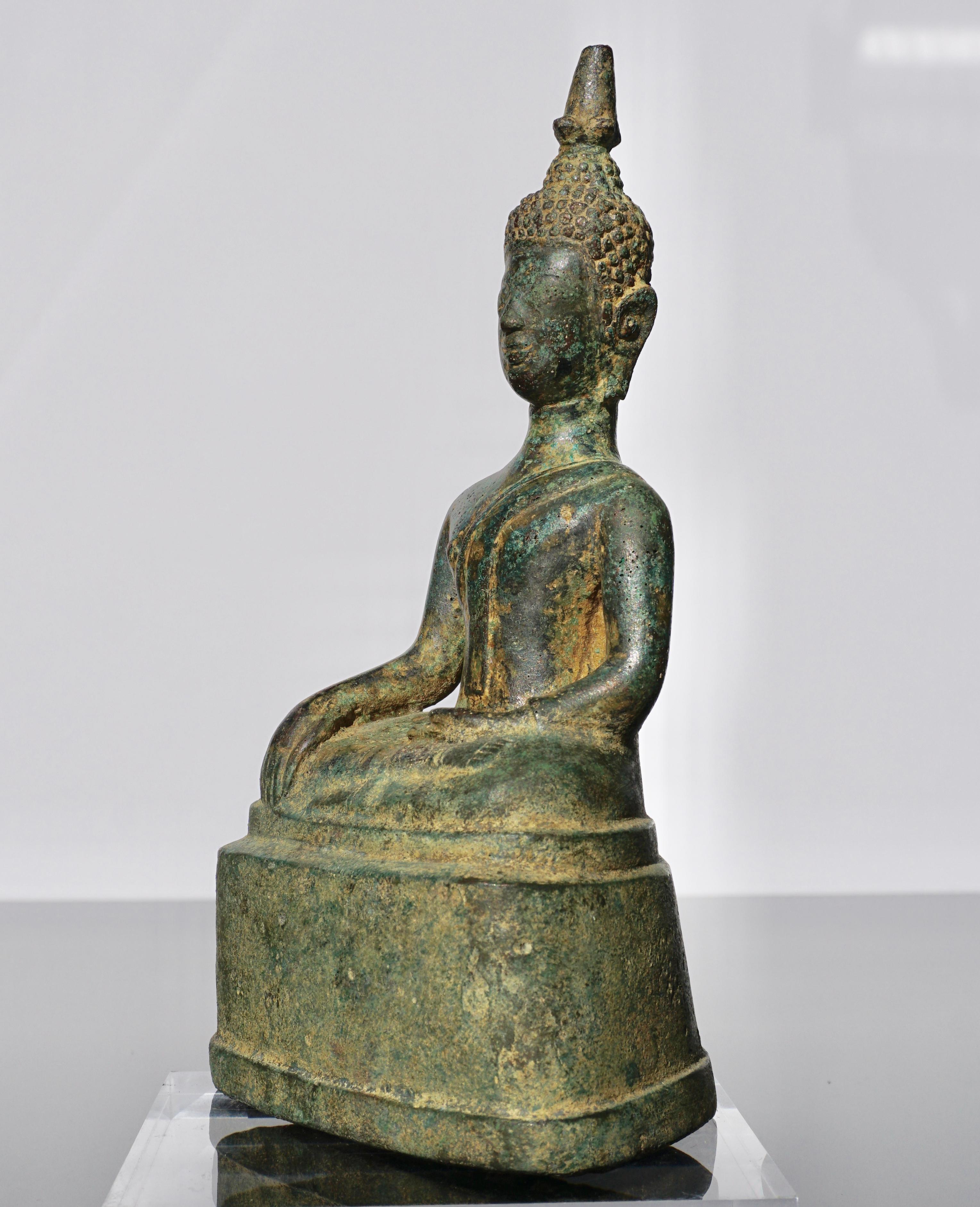 A bronze seated figure of Buddha Statue Thailand, Ayutthaya period, 15th-16th century (early Ming dynasty period) 

This Buddha is seated on a pedestal in the cross-legged yogic posture of satvaparyankasana, the right leg placed over the left. His