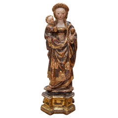 XVe Vierge et Child en bois polychrome et doré. Sur un piédestal. Malines.