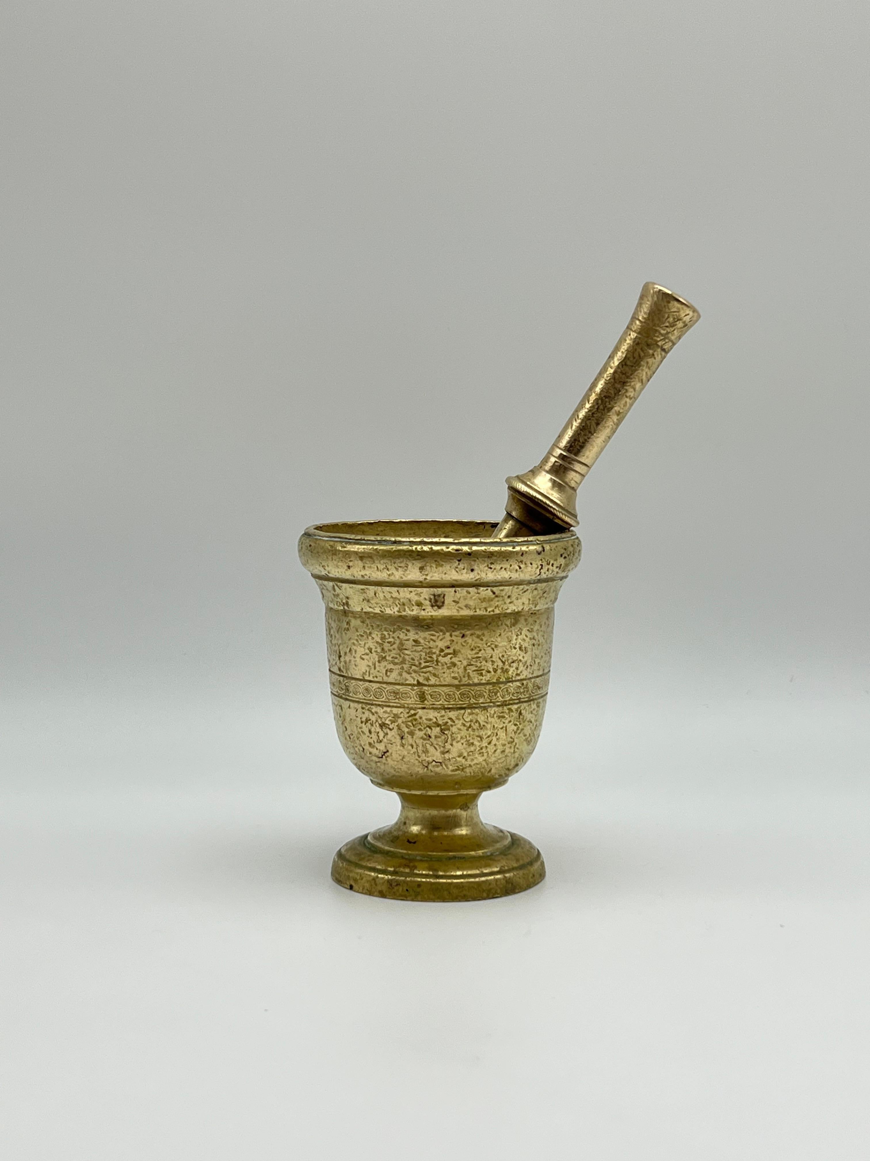 Antique French Apothecary Mortar and Pestle, Hand Cast Brass / Bronze, 17th / 18th Century.

This rare primitive mortar and pestle, handcrafted in France during the 17th or 18th century, showcases exquisite hand-forged brass or Cast bronze with
