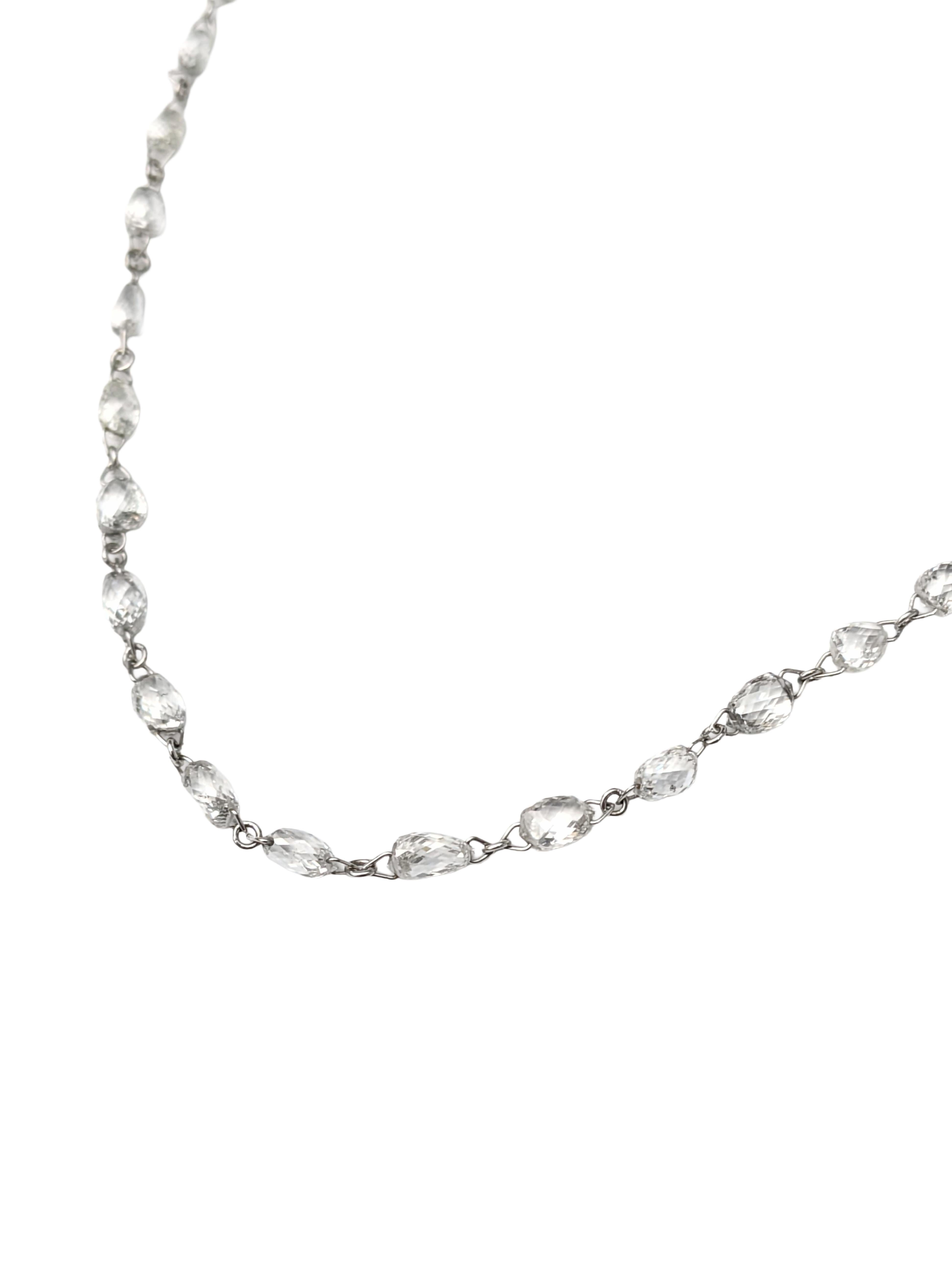 A refined essential with effortless sparkle. This delicate 18K white gold necklace features faceted white diamond beads hand-wrapped in 18K white gold wire and spaced gracefully along the chain, creating a soft shimmer with every movement. The