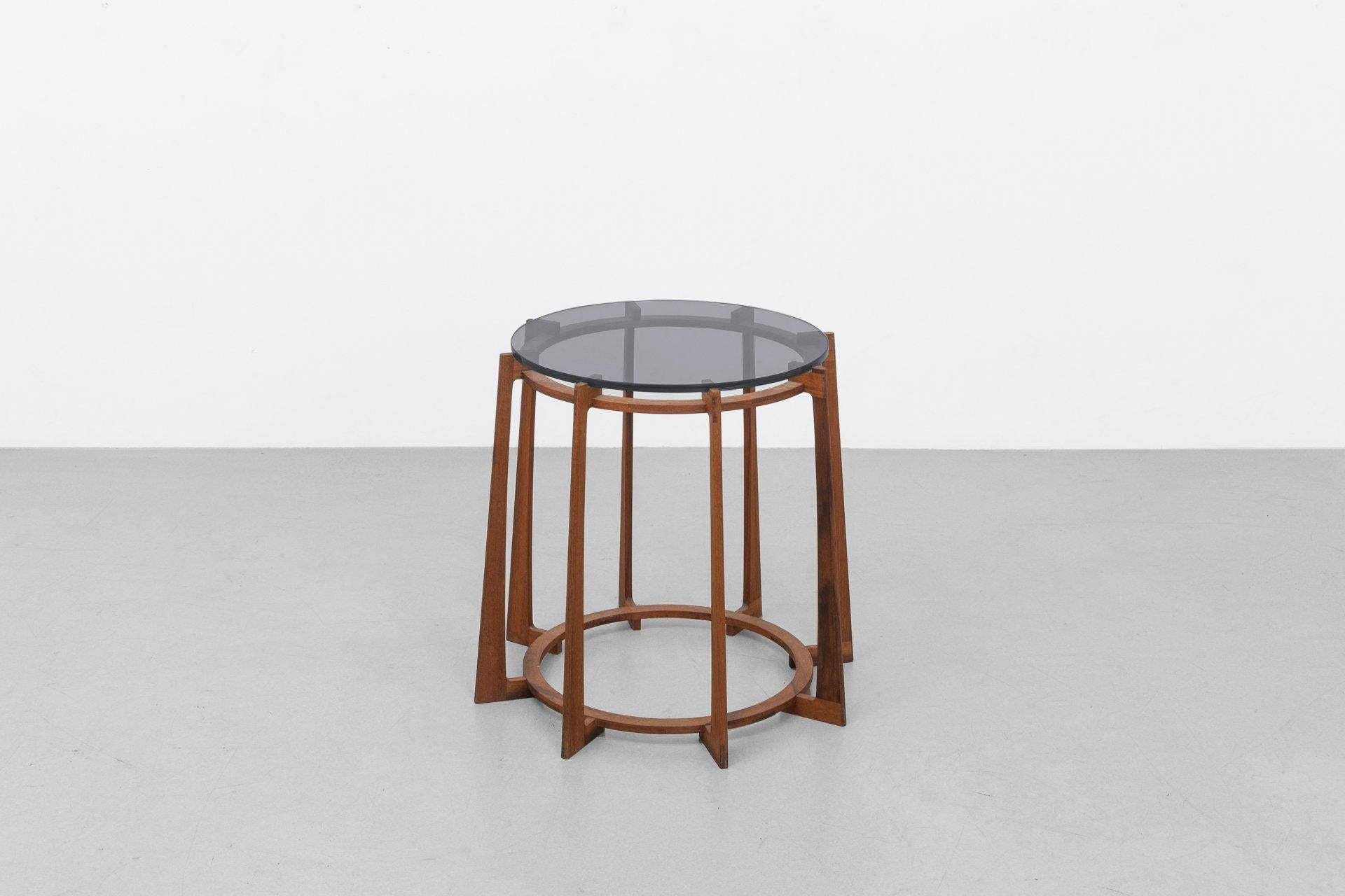 The 16/45 end table strikes a balance between sleek and sturdy. Crafted from walnut, the table's lean, tapered base cradles a smoked grey glass top. Its graceful and understated form adds sophistication to any space. 

The War Craft Collection was