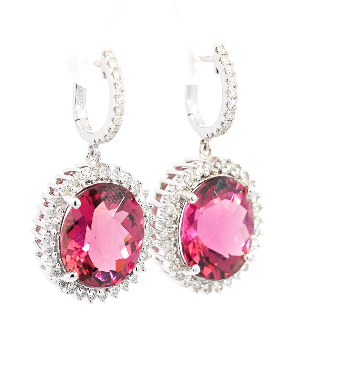 These 18K white gold earrings, weighing a total of 9.24 grams, showcase a dazzling combination of approximately 16 carats of tourmaline and diamonds. Each earring features a checkerboard oval-cut Pink tourmaline, 8.16 carats and 7.78 carats,
