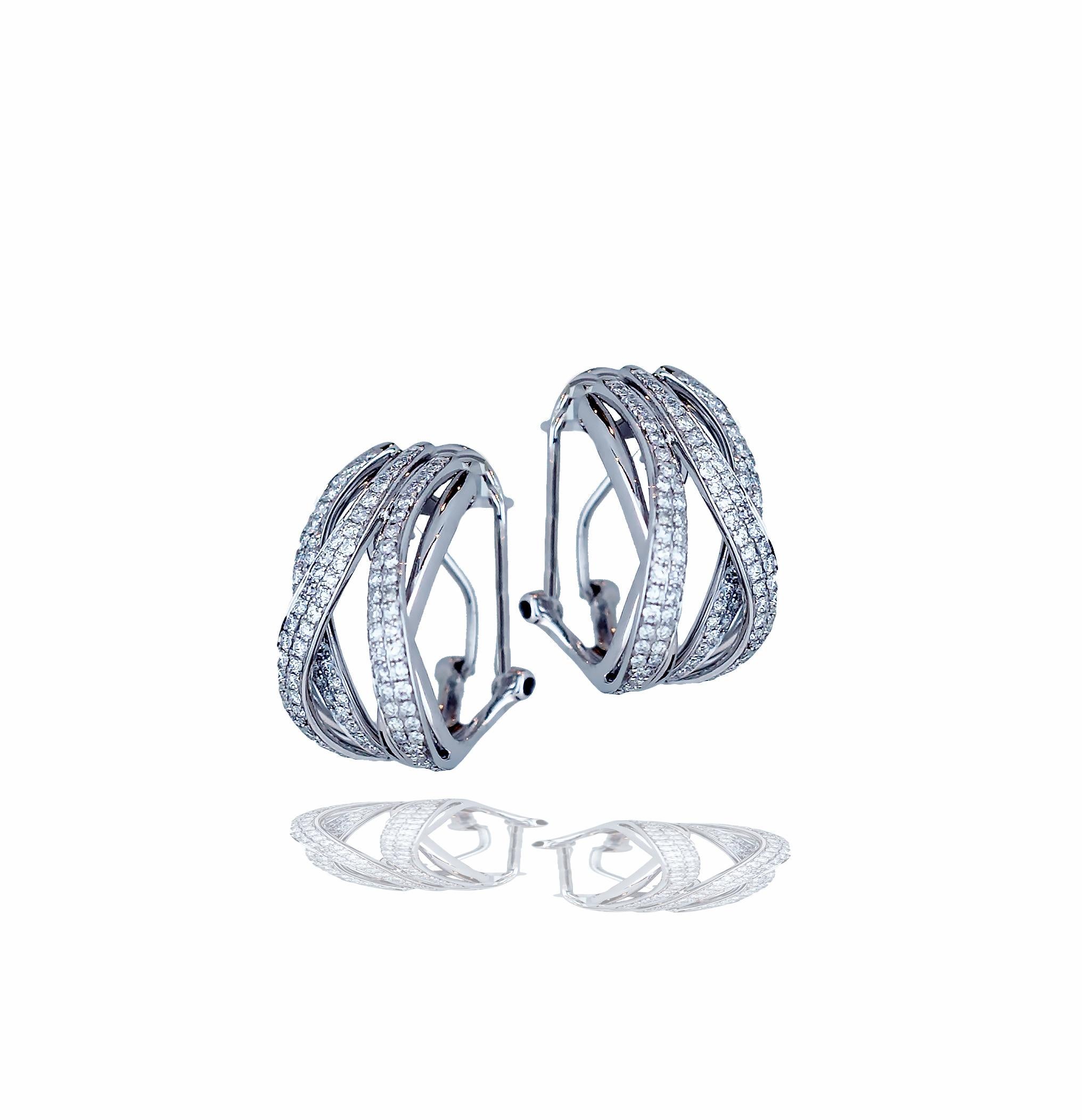 A stunning pair of daily wear can be seen in these criss-cross diamond hoops.  The hoops measure 12 mm and have lever backings.  The hoops weigh approximately 12 grams and have over one hundred diamonds that are F-G VS-SI color and clarity.  The