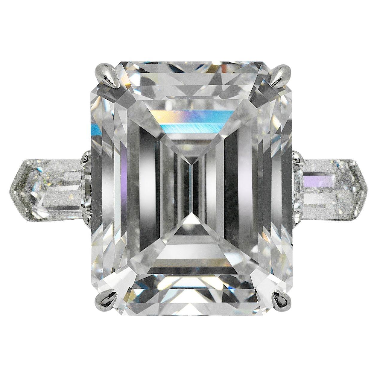 MELODY  EMERALD  DIAMOND ENGAGEMENT RING IN PLATINUM  BY MIKE NEKTA

GIA CERTIFIED
Center Diamond
Carat Weight: 14.6 Carats
Color :  D*
Clarity: VVS1
Style:  EMERALD CUT 
Measurements:  16.3 x 11.7 x 7.7 mm
*Color Treated
 
Ring:
Metal: