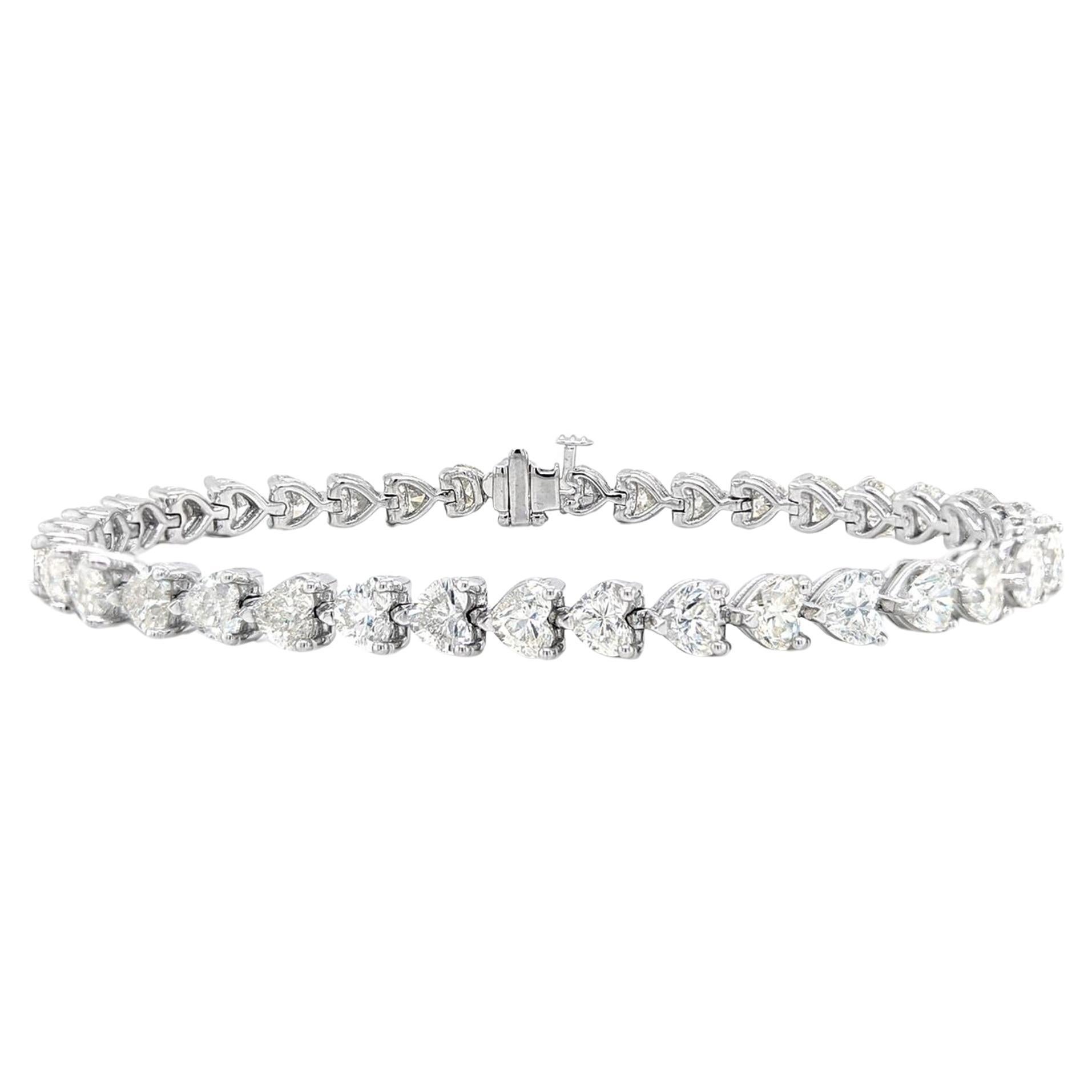 16 Carat 3 Prong Airline Diamond Tennis Bracelet in 14K White Gold!

Elevate your style with our exquisite Diamond Tennis Bracelet, a masterpiece featuring a unique 3 prong airline design. Adorned with 51 heart diamonds, totaling an impressive 16.12