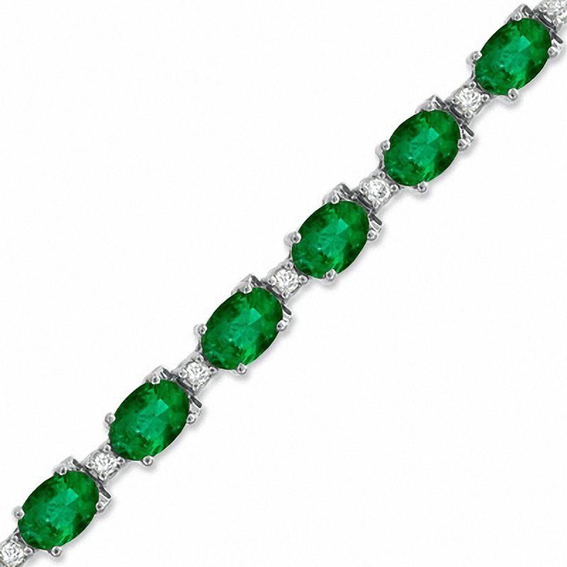  This exceptionally affordable Tennis  bracelet has  18 stones of oval  Emeralds  . Each Emerald is spaced by one diamonds . Total weight of the Emeralds is  approximately 16  carat. Total number of diamonds are 18 and diamond weighs is
