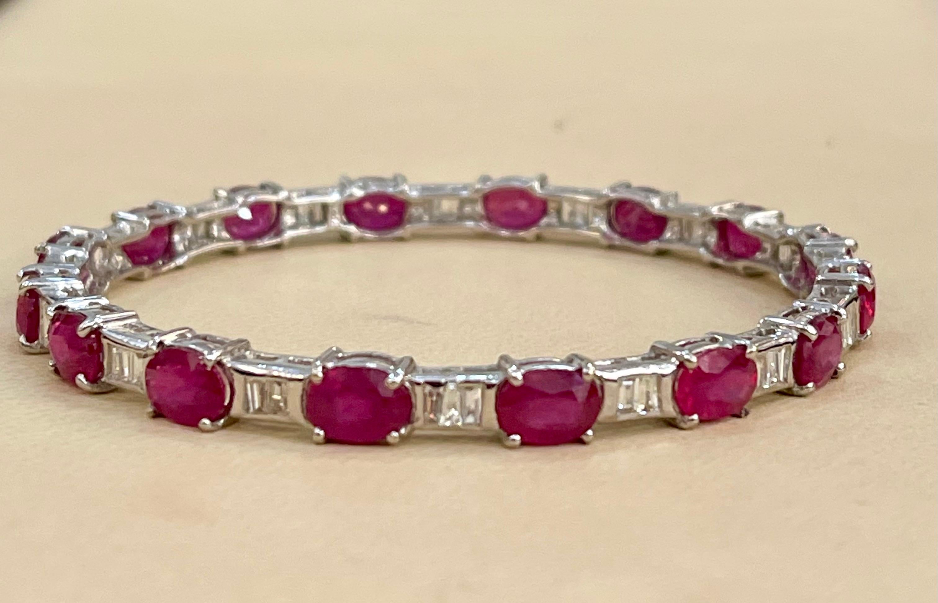  16 Carat Oval Treated Ruby & Diamonds 18 Karat White  Gold 19 Grams Bangle 
It features a bangle crafted with  18 karat White gold and  Baguettes cut diamonds 
Rubies  16 pieces , each  5 X 7  MM approximately 1.0 ct each , total weight 16