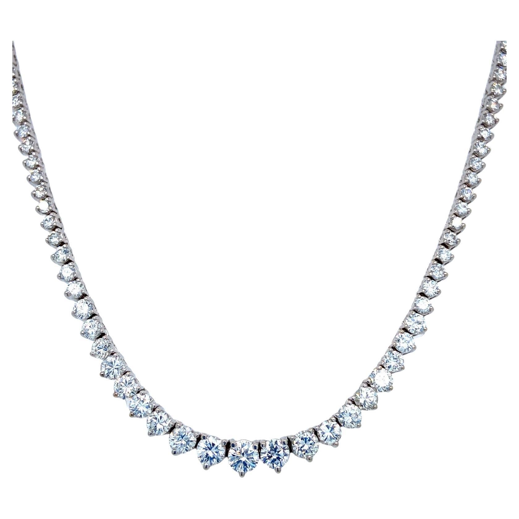 This exquisite graduated riviera necklace set in handmade 14k white gold featuring perfectly cut ideal round brilliant diamonds. the super white diamonds are in h/i color and VSi/vs2  clarity with a total carat weight of 14.55 carats This precious