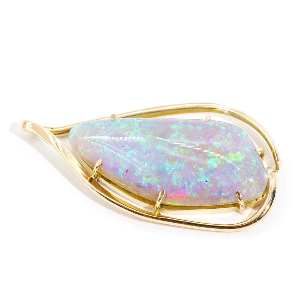 Lovingly crafted in 18 carat yellow gold is this enchanting vintage pendant with an alluring solid Australian crystal Opal taking centre stage, and carefully set in a fine six claw setting. This striking piece we have named The Brodie Pendant  The