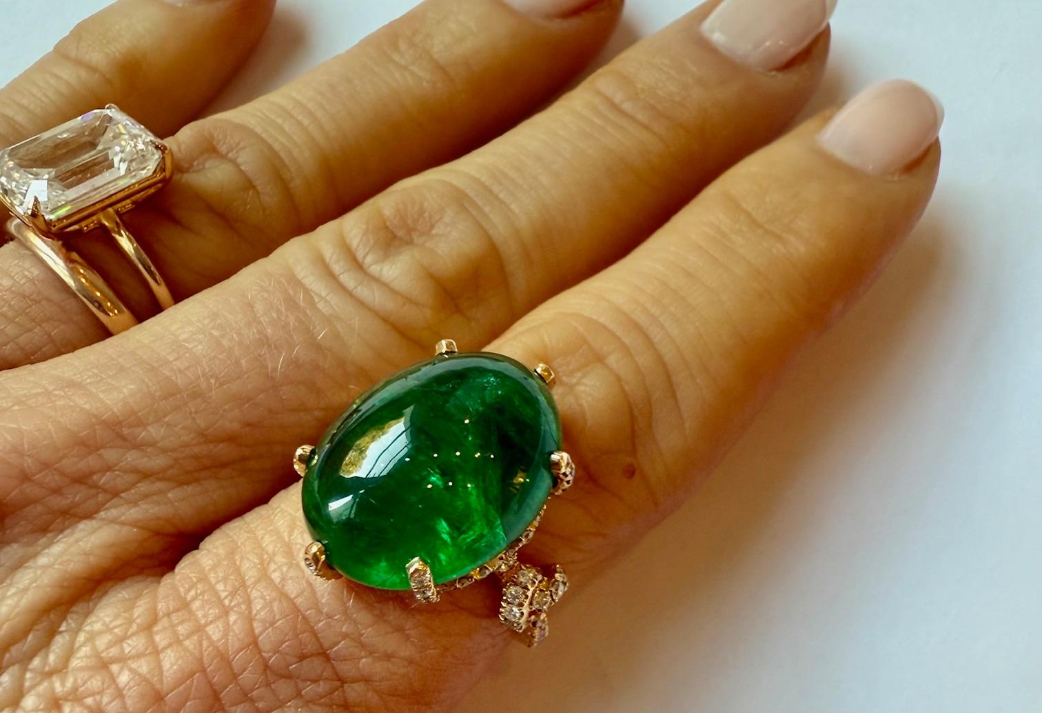 Emerald Cabochon and diamond ring hand set in 18 carat yellow gold. This Stone has such vibrant color to it! The diamonds are F Color and sparkle so beautifully.  This ring works perfectly as a cocktail ring or as a fashion ring with  others!
