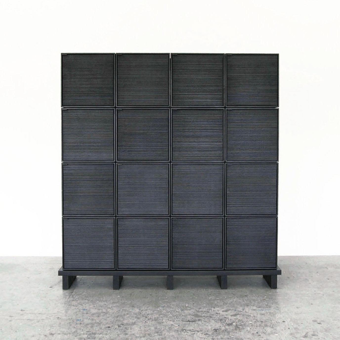 16 cubes cabinet by John Eric Byers
Dimensions: D150 x W38 x H165 cm
Materials: sawn + blackened + maple + ash

All works are individually handmade to order.

John Eric Byers creates geometrically inspired pieces that are minimal, emotional,
