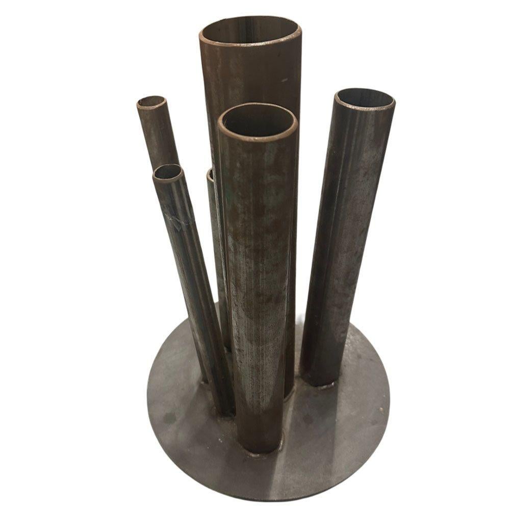 Original hand man striking industrial loft bud vase featuring a five asymmetrical stainless steel tubes of varying heights. This vase was custom made by an unknown metalworks studio.

16