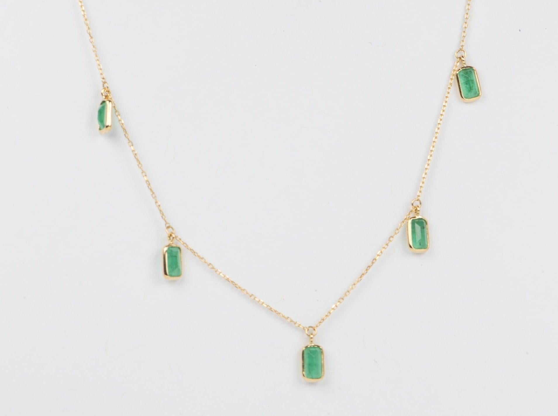 ♥ This beautiful necklace features 5 vibrant green emeralds encased in buttery 18K gold bezel setting
♥ This is a dainty chain that can be worn alone or layered with other necklaces.
♥ The necklace measures 16