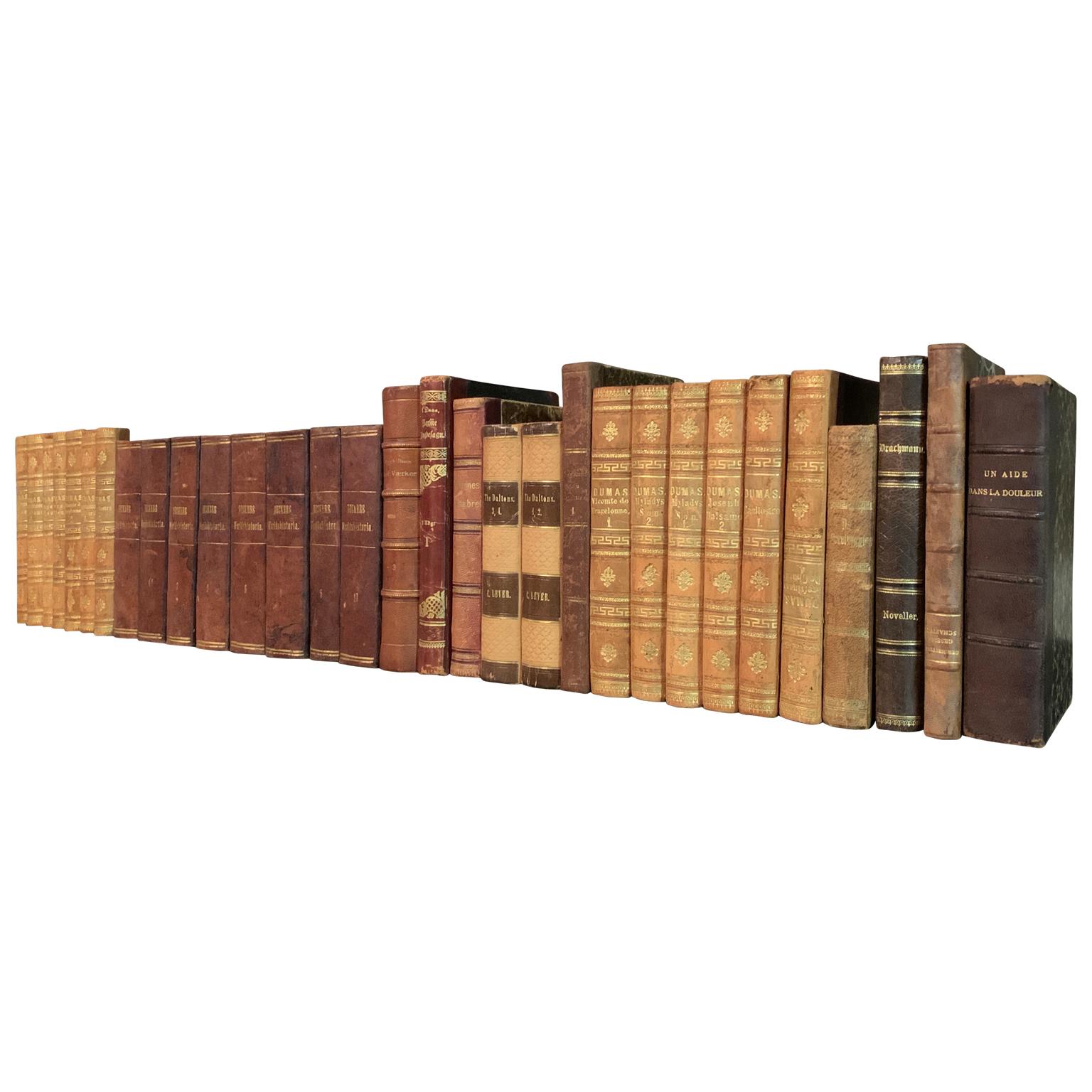 A collection of European decorative antique leather-bound library books dated from 1832-1908, 16 feet in total.
This lot of books is from the following four European countries; Denmark, Sweden, France and Great Britain. The books are wrapped in
